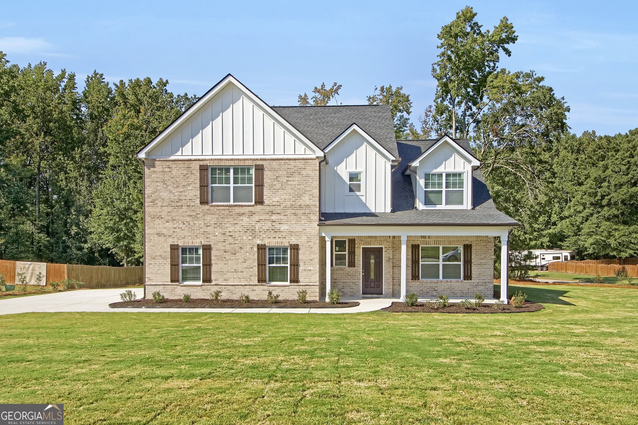NEW CONSTRUCTION - Move-In Ready in McDonough! Discover this brand-new contemporary-traditional home offering 5 bedrooms, 3.5 baths, and an open-concept design that blends modern style with everyday comfort. Situated on a rare .9-acre lot in an upscale, quiet community with NO HOA, this property provides the perfect mix of privacy, space, and convenience. Step inside to find a bright, inviting interior featuring a main-level in-law suite with private bath, plus an additional half bath-ideal for guests or multi-generational living. The chef's kitchen showcases 42" white cabinets, quartz countertops, stainless steel appliances, a large center island, and direct views into the great room. The living area is anchored by a sleek, multi-colored remote-controlled electric fireplace, creating the ultimate gathering space. Upstairs, retreat to the luxurious primary suite with 9' tray ceilings, a spacious walk-in closet, a dual vanity, and a glass-enclosed shower. Additional bedrooms are generously sized, offering flexibility for family, office space, or hobbies. This home is designed with quality and efficiency in mind: Dual HVAC system, Luxury vinyl plank flooring on the main level, Premium finishes throughout, Built by MAR Investments Inc., a boutique builder known for attention to detail. Warranties & Buyer Benefits: 2-10 New Construction Home Warranty, 1-Year Appliance Warranty, 1-Year Termite Bond, Full Plat Survey Included. Prime Location: Minutes from shopping, dining, schools, and entertainment-close enough for convenience, yet tucked away for peace and quiet. Buyer Incentives: Seller is offering up to $10,000 in buyer concessions plus an additional $2,000 credit with preferred lender, Homestar Mortgage - a Division of American Pacific Mortgage. This home also qualifies for the Georgia Dream Down Payment Assistance Program for eligible buyers. Don't miss this opportunity to own a move-in ready new construction home in McDonough with no HOA, nearly an acre of land, and unbeatable incentives!