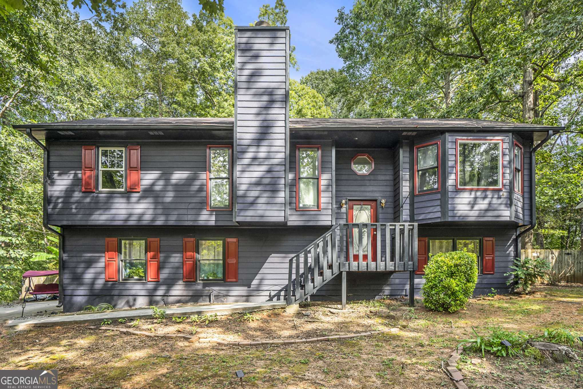 Spacious 4-bedroom, 3-bathroom home with a finished in-law suite and two full kitchens. The main level features an updated kitchen with modern finishes, a primary suite with bay window, walk-in closet, and en suite bath with double vanities and garden tub. The lower level offers a private in-law suite with oversized bedroom, full bath, living/dining area, and kitchen with butcher block countertops-perfect for extended family or guests. Enjoy plenty of storage, a large laundry room, and an expansive deck overlooking the wooded backyard, ideal for entertaining.