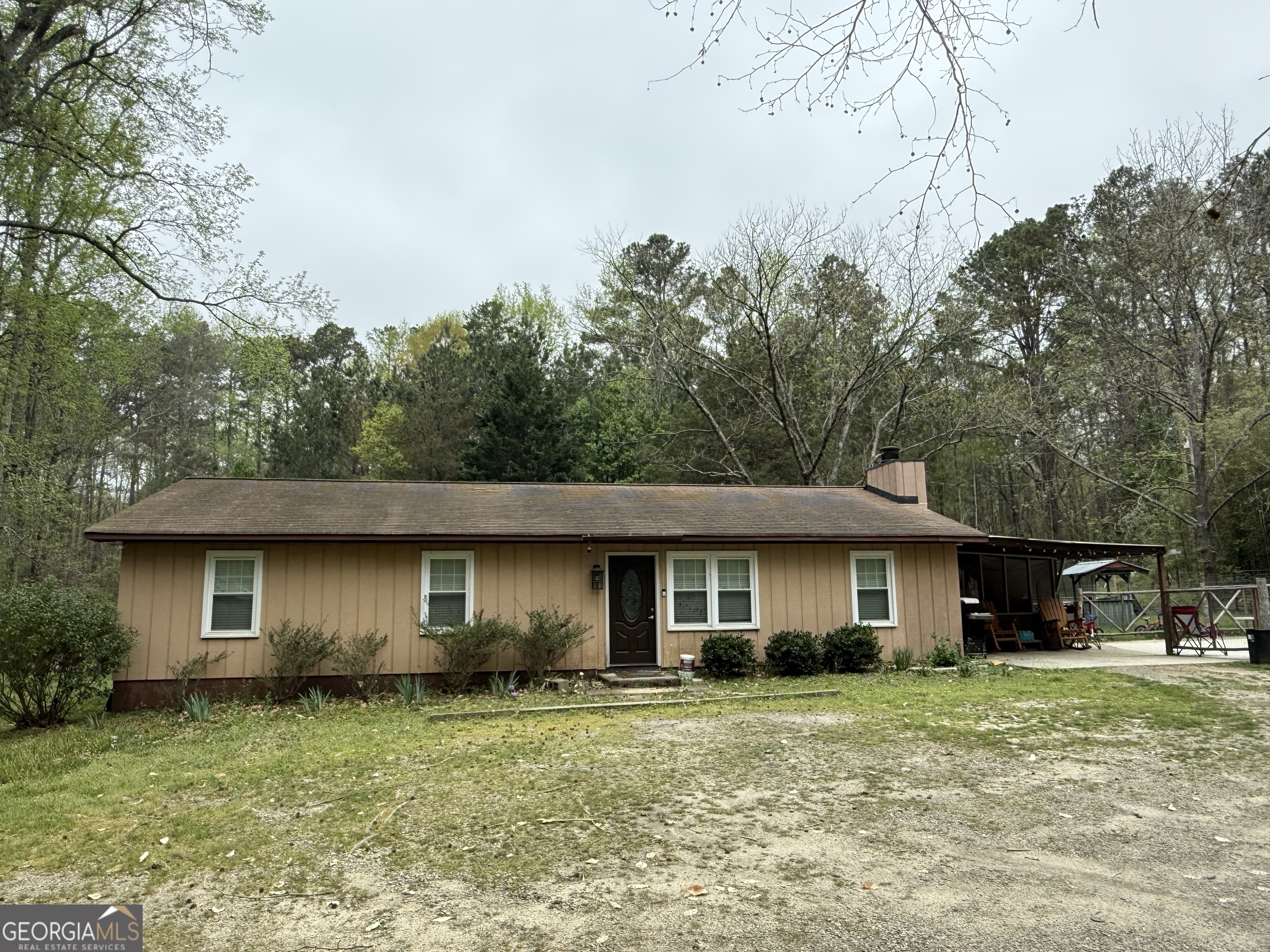 Rare find in Gwinnett County! This large parcel is half residential and half commercial providing true versatility! Completely renovated inside down to the ductwork! Perfect for homesteading, development, investment or buy and hold! Creek and Basketball Court on Property! Right of off Highway 124 with easy access to Highway 78 and I-20. Large shelter already in place perfect for camper hookup or RV/Boat/ATV Parking. Extra outbuilding for storage. No HOA! / No HOA!! / No HOA!!! ensures that you can fully embrace the lifestyle you desire without any limitations.
