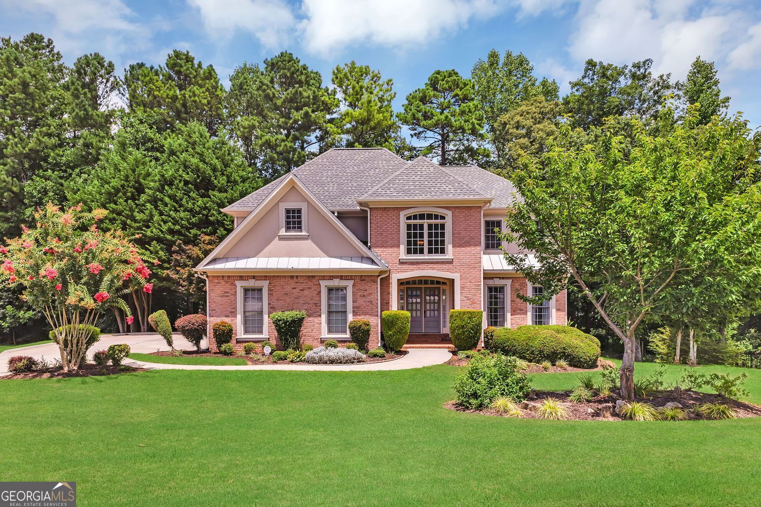Welcome to a spectacular home, a perfect setting for family enjoyment.The open and bright interiors are flanked by gleaming hardwood floors. This exceptional home is a stunning masterpiece that showcases an impressive array of design elements. As you approach the residence, you are greeted by a beautifully manicured entrance that sets the tone for what lies beyond. The meticulous landscaping, accentuated by vibrant flowering trees and lush greenery, invites you to explore this sanctuary. Upon entering through the front entry, you are captivated by the soaring ceilings that embrace you with a sense of spaciousness and openness. The expansive foyer, bathed in natural light, serves as a warm welcome and transitions into the various living spaces, including a first-floor secondary bedroom currently being used as an office. The living areas are adorned with exquisite designer finishes. An inviting fireplace serves as the focal point in the great room, creating a cozy atmosphere perfect for those cooler evenings or unwinding after a long day. Large windows frame a picturesque view, allowing light to pour into the first floor from the outside. As you step into the home, you will find a gourmet kitchen equipped with top-of-the-line appliances and ample counter space, providing the perfect environment for preparing and enjoying delectable meals. The elegant cabinetry and luxurious finishes create a stunning backdrop, ready to inspire countless culinary adventures. An adjacent gracious-sized dining room offers the perfect setting for both family meals and festive dinner parties. The living experience continues as you explore the second floor of the home. The three generously sized bedrooms are havens of peace and tranquility, each designed to offer a retreat from the day's hustle and bustle. The primary suite, a true oasis, boasts a spa-inspired en-suite bathroom with luxurious finishes. Relax and rejuvenate in the expansive soaking tub or enjoy the shower, all designed to elevate your daily routine to new heights of indulgence. An added plus is the custom-designed closet, along with a spacious dressing room. Additionally, this magnificent property offers multiple spaces for leisure and entertainment, including a beautifully designed outdoor living area that seamlessly extends from the interior. Picture yourself hosting summer barbecues, cozying up around a fire pit on cool evenings, or simply soaking in the beauty of your surroundings in this serene outdoor retreat. The potential for creating unforgettable memories in this space is endless. This executive home offers a blend of luxury, functionality, and style. It presents an unparalleled opportunity for discerning buyers. This home is ready to embrace its new owners with open arms, promising many cherished memories for years to come in one of the area's sought-after communities.