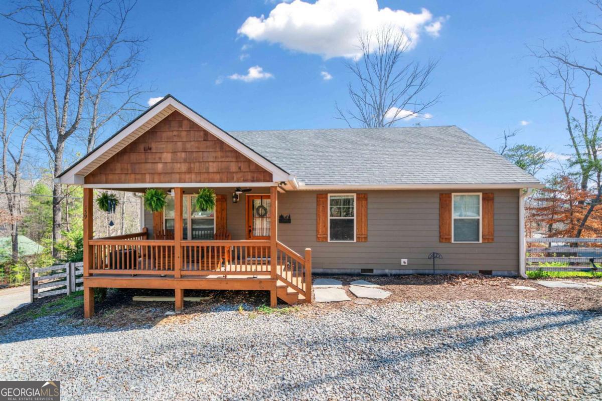 ***Extremely motivated sellers!*** Welcome to your charming mountain retreat in the sought-after Coosawattee River Resort. This cozy yet surprisingly spacious feeling 1,200 sq ft ranch-style home, just two years old, offers the perfect blend of petite charm and open-airy comfort. Sitting on a spacious corner lot with breathtaking 180-degree ridgeline mountain views, this home has been lovingly maintained and thoughtfully upgraded by its original owners. While it's a smaller home-about 1,200 square feet-it feels much larger thanks to soaring cathedral ceilings that create an airy, open ambiance throughout the living space. The open-concept design is filled with natural light, making the home feel bright and inviting. The front yard is beautifully landscaped, and in the back, you'll find a garden bursting with hundreds of vibrant perennials, creating a serene outdoor haven. Inside, you'll enjoy luxury vinyl plank flooring throughout, upgraded light fixtures, and fresh interior paint. The primary suite is spacious with a dual vanity, walk-in shower, and linen closet. Two additional bedrooms offer plenty of space for family or guests. The screened-in back porch is perfect for relaxing year-round, while the fenced backyard with a fire pit provides a cozy spot for gatherings. The horseshoe driveway offers ample parking, adding to the home's functionality. Beyond the home, Coosawattee River Resort provides an unmatched mountain lifestyle with gated security, multiple pools, river access, a fitness center, tennis courts, parks, trails, and abundant wildlife. This move-in-ready home combines modern comforts with the peaceful serenity of the mountains. Don't miss your chance to own this exceptional property-schedule your private showing today!