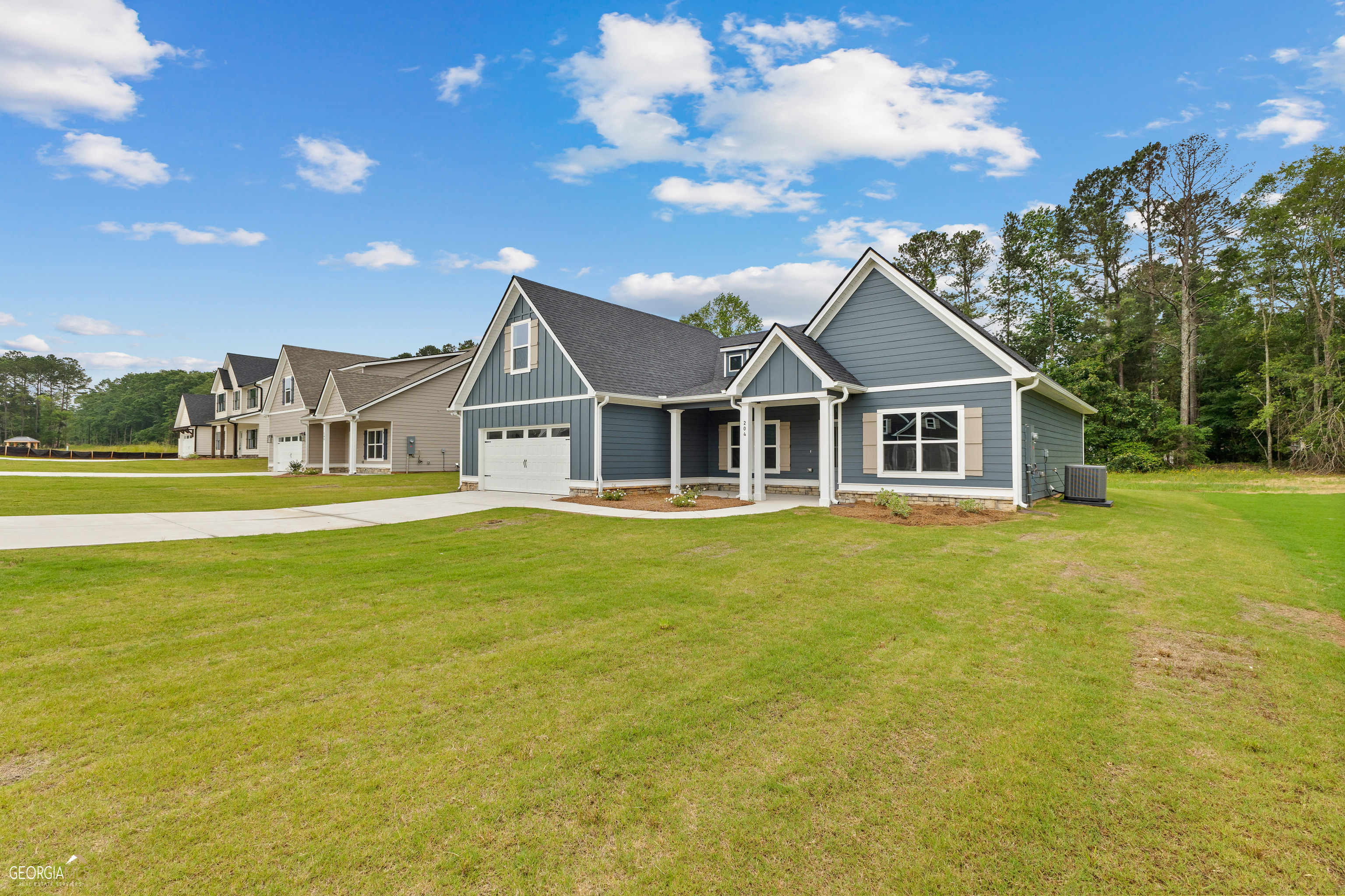 This Copeland floor plan in Standing Oaks Subdivision offers a split bedroom arrangement, with a large owner's suite AND two additional bedrooms on the main floor. The kitchen features an island bar PLUS a breakfast area, which opens to the family room. A spacious bonus room on the upper level has a walk-in closet and a full bathroom. A covered rear porch allows for great outdoor living! NOTE...taxes not established yet. Taxes will be estimated at closing.
