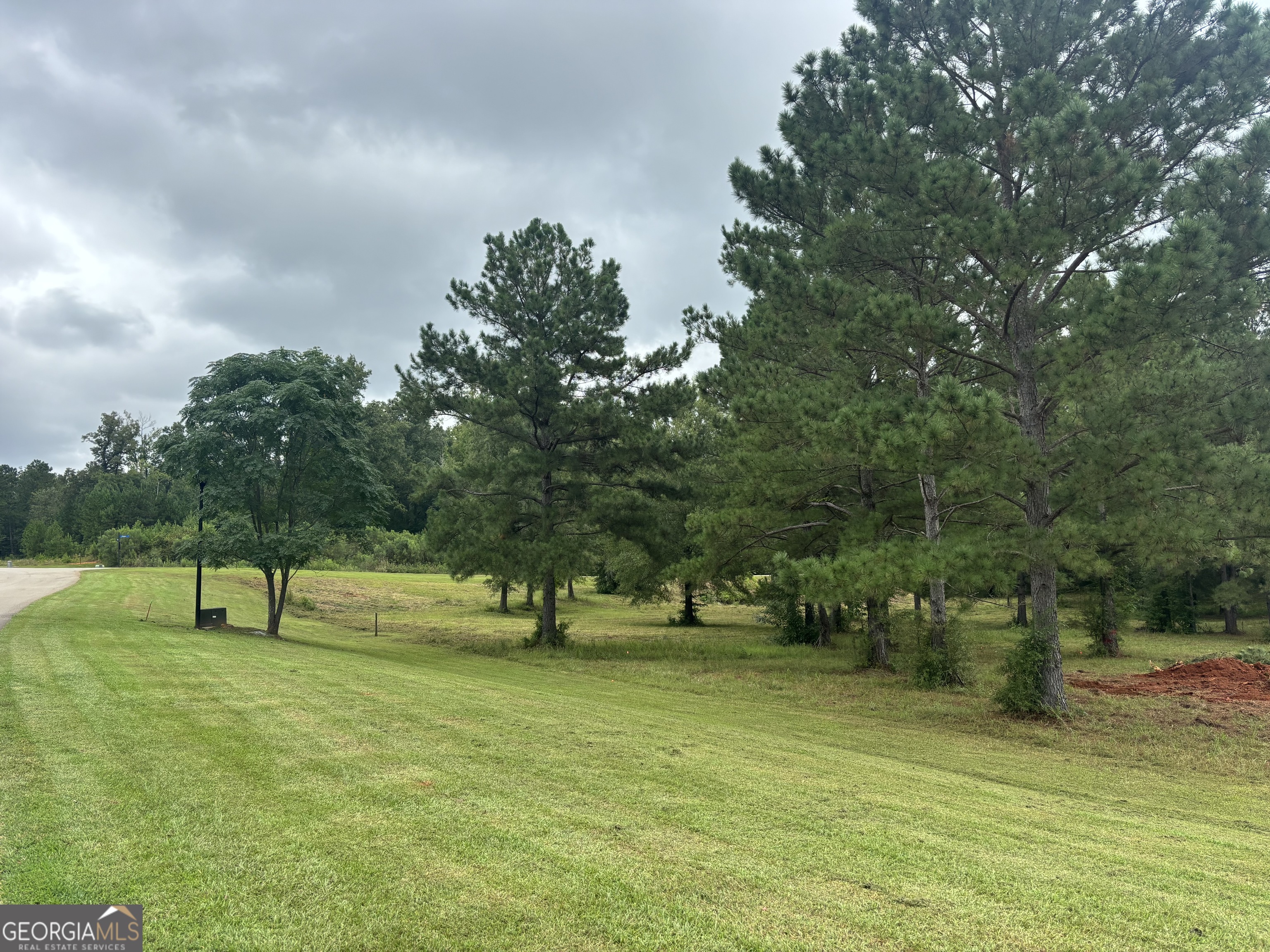 Looking for the perfect spot to build your dream home? This beautiful 2.4-acre corner lot in the gated community of Eagles Pointe could be just what you've been waiting for. Backing up to a peaceful creek and surrounded by nature, it offers plenty of space and privacy with a relaxed, scenic setting. Underground utilities are already in place, so you can get started on your plans right away. The neighborhood has great amenities for all ages, including a playground, a covered pavilion for get-togethers, a private dock, and even a boat ramp with easy access to Lake Tobesofkee. With its natural beauty, generous lot size, and unbeatable location near the lake, this property is a rare find in one of Middle Georgia's most desirable neighborhoods. Come see why Eagles Pointe is the perfect place to call home!