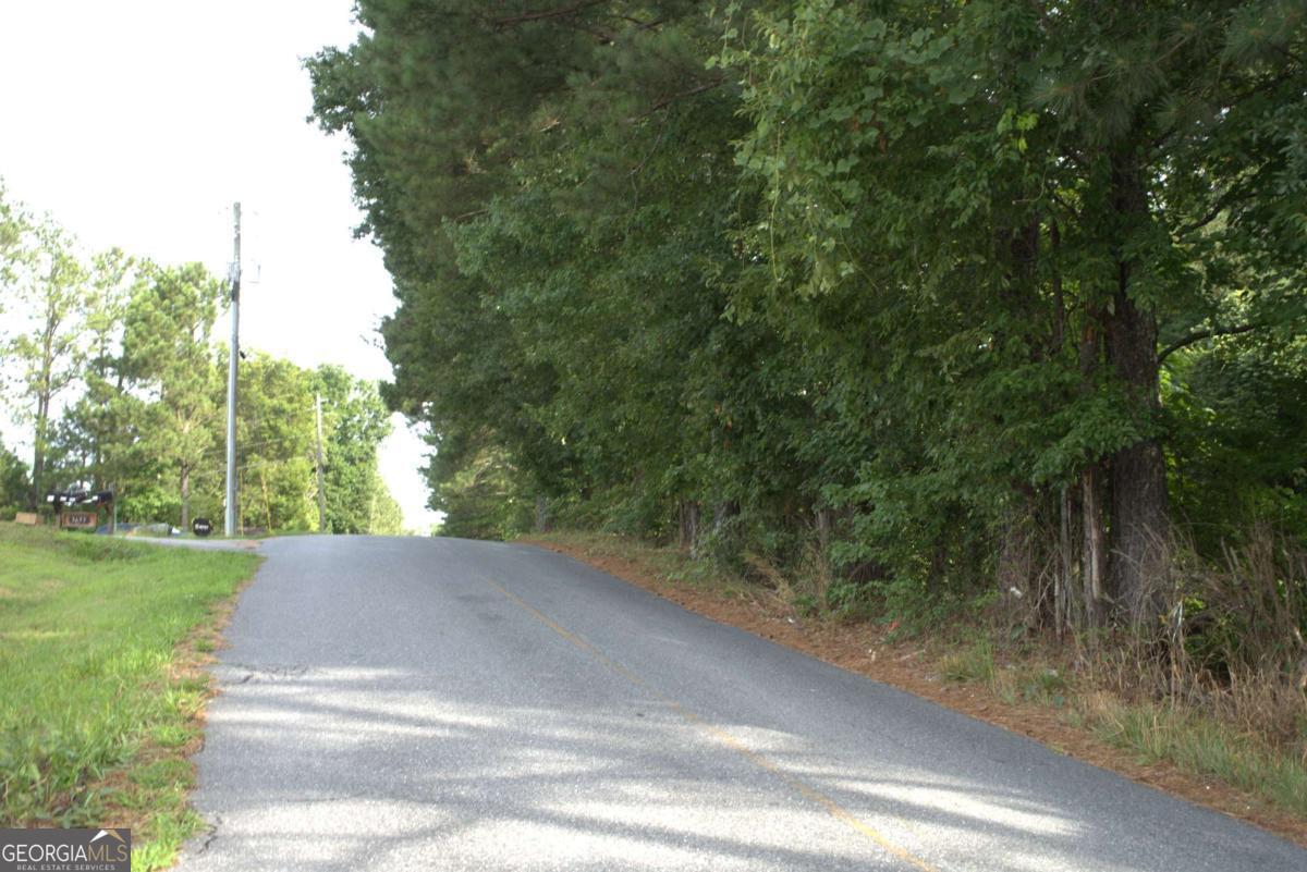 Prime investment opportunity in a growing area. Surrounded by ongoing commercial and residential development, this property offers excellent visibility and accessibility with immediate access to I-75 and Highway 92. Located just minutes from downtown Acworth, the site can be acquired along with an adjacent 2-acre parcel, totaling 3 acres - ideal for future development.