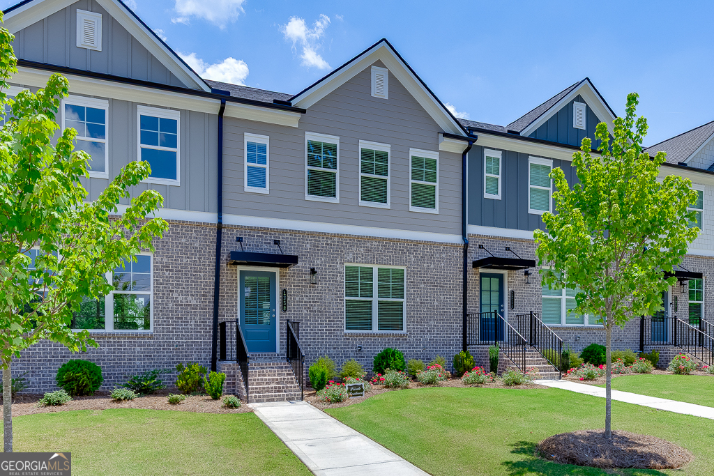 Stunning New Townhome Steps from the Action at Sugar Hill! Welcome to Lot 46 - The Oakfield Plan (Elevation D), a gorgeous new 3-story townhome perfectly positioned in the heart of Hillcrest Landing-just minutes from the energy and entertainment of downtown Sugar Hill! Live where the action is! This home is nestled near the famous Sugar Bowl amphitheater, home to year-round concerts, events, and vibrant nightlife. Whether you're catching a live show, enjoying local food trucks, or strolling through weekend markets, you're always just steps from something exciting. And if you're looking for a moment of quiet inspiration, the highly regarded Sugar Hill Church is just around the corner. Inside, this rear-entry, 2-car garage townhome delivers top-of-the-line finishes, including luxurious RevWood laminated wood flooring, custom tile accents, and stylish quartz and granite countertops. Every detail has been thoughtfully designed to reflect today's latest trends, from paint colors to fixtures, creating a polished and inviting atmosphere. This is more than a home-it's a lifestyle. Enjoy proximity to: Downtown Sugar Hill's charming boutiques and restaurants The E Center-a premier athletic and recreation facility The Eagle Theater and scenic walking trails Major highways I-985 and GA-400, plus quick access to the Mall of Georgia Note: Interior and select exterior photos are of the model home and are used for illustrative purposes only. Don't miss this incredible opportunity to own a stylish new home with unbeatable location and amenities. Come experience the best of Sugar Hill living at Hillcrest Landing! All applicants must have a 620 minimum credit score, no criminal history or evictions, and 3x monthly income.