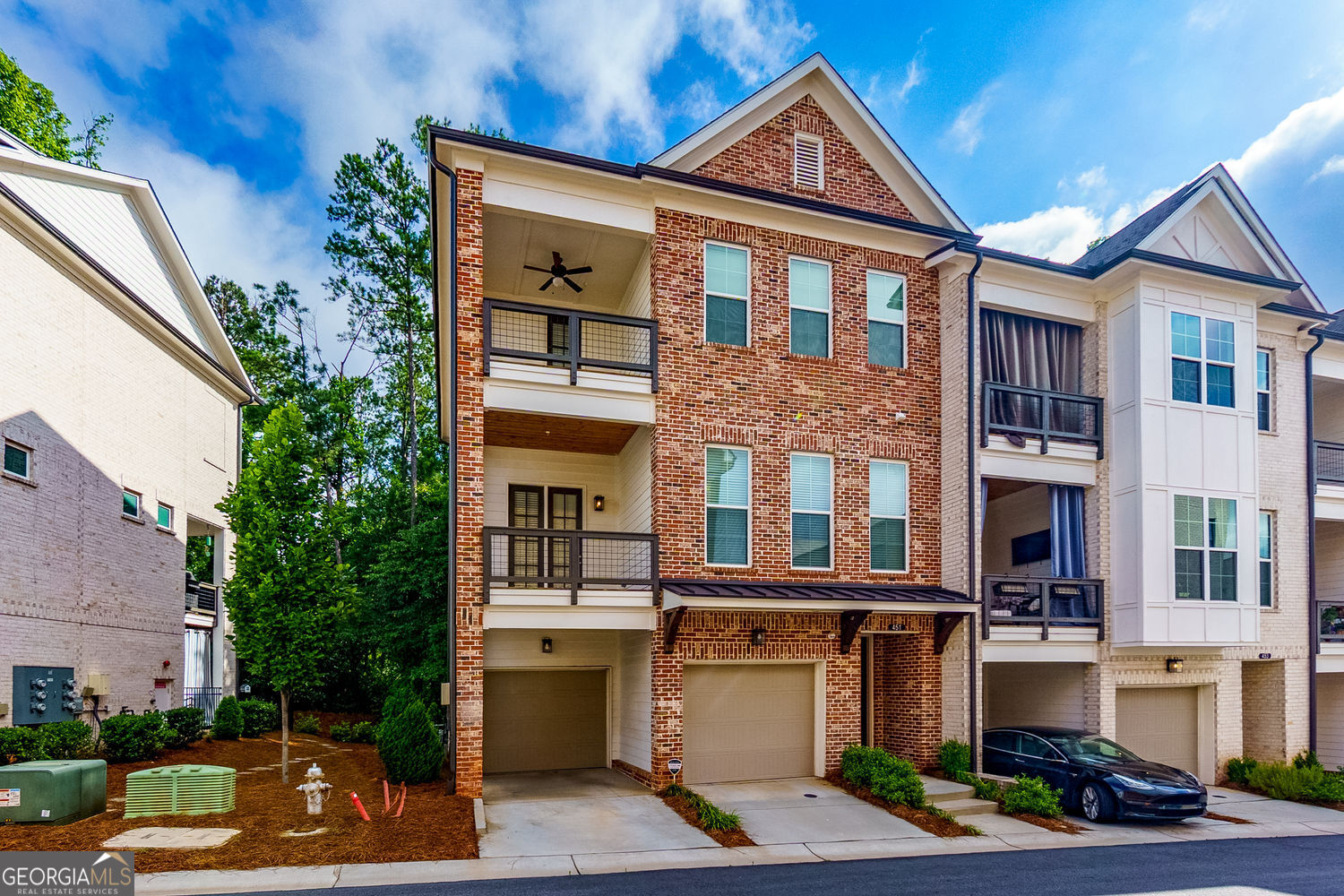 Welcome to your dream home in the heart of Alpharetta! This stunning end-unit townhouse, a gorgeous brownstone from The Providence Group, boasts top-tier upgrades, including exquisite Cambria countertops and seamless Alexa smart home capabilities throughout. With an eager seller motivated to find the right buyer, this is an opportunity you won't want to miss! Spanning three stories, this 4-bedroom, 3.5-bathroom open-concept townhome is designed for modern living. The main floor features a beautiful chef's kitchen with a large island that overlooks a spacious family room-a perfect space for entertaining or unwinding. Enjoy the outdoors from one of the three covered decks or the cozy fenced backyard. The expansive owner's suite is a true sanctuary, complete with an elegant en-suite bathroom featuring a luxurious free-standing tub, a separate shower, and its own covered deck for relaxing evenings. Located in a vibrant mixed-use development, you can truly live, work, and play right at your doorstep. Just steps away from Maxwell retail and the Alpha Loop, you'll have access to a variety of shops and restaurants, including popular spots like Fairway Social, Poncho Chicken, Lily's Sushi, and BodyBar, plus the Alpharetta Square just a half-mile away. Community amenities include a refreshing pool, a charming cabana, bocce ball courts, and a firepit for cozy gatherings. This home truly embodies the best of Alpharetta living. Don't hesitate-bring your offer today and seize this incredible opportunity!