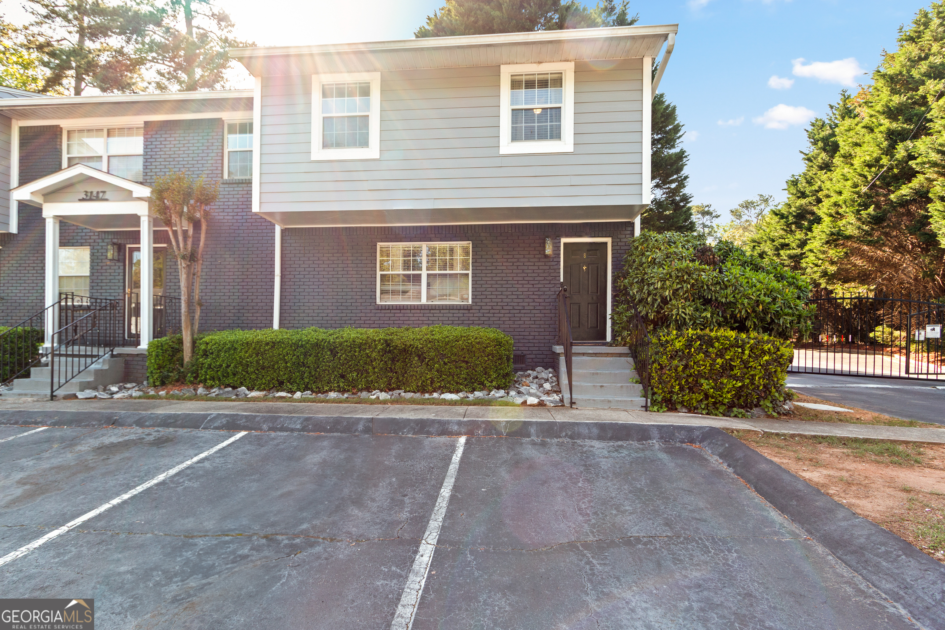 This spacious and well-maintained end unit offers a fantastic layout and tons of natural light. The main floor features a welcoming foyer, a generous living room, formal dining area, and a convenient powder room. The kitchen is equipped with built-in pantry shelving and a wine fridge-perfect for entertaining. Step out from the dining area to a private patio that overlooks the beautifully landscaped grounds of the community. Additional highlights include a large storage closet under the stairs and no carpet throughout the home. Upstairs, you'll find three spacious bedrooms, including a primary suite with a private en suite bath. A second full bathroom is located in the hallway. Enjoy peace of mind with a new HVAC system (only 1 year old)! CONVENIENT AMENITIES: Enjoy unmatched convenience with two assigned parking spaces right in front of your condo. This gated community offers a variety of perks, including a refreshing swimming pool, BBQ area, lush green spaces, and dedicated dog-walking areas. Outdoor enthusiasts will love the direct access to the Peachtree Creek Greenway a true gem for walking, biking, and exploring nature. SMART STORAGE SOLUTIONS: You will have plenty of room for all your belongings with multiple storage options, including an attic crawl space and shared basement storage located directly beneath the unit. HASSLE-FREE LIVING: Community fees cover water, sewer, trash, and access to all amenities simplifying your monthly expenses and providing peace of mind. PRIME LOCATION: Situated just steps from the scenic Peachtree Creek Greenway 12 miles of connected green space this home also offers easy access to I-85 and GA-400. Your just 10 minutes from downtown Atlanta and only 2.5 miles from Lenox Mall and Phipps Plaza, with shopping, dining, and recreation all within easy reach. DONT MISS OUT: This is your chance to own a charming home in one of Atlanta'S most vibrant and up-and-coming neighborhoods. Schedule your tour today!