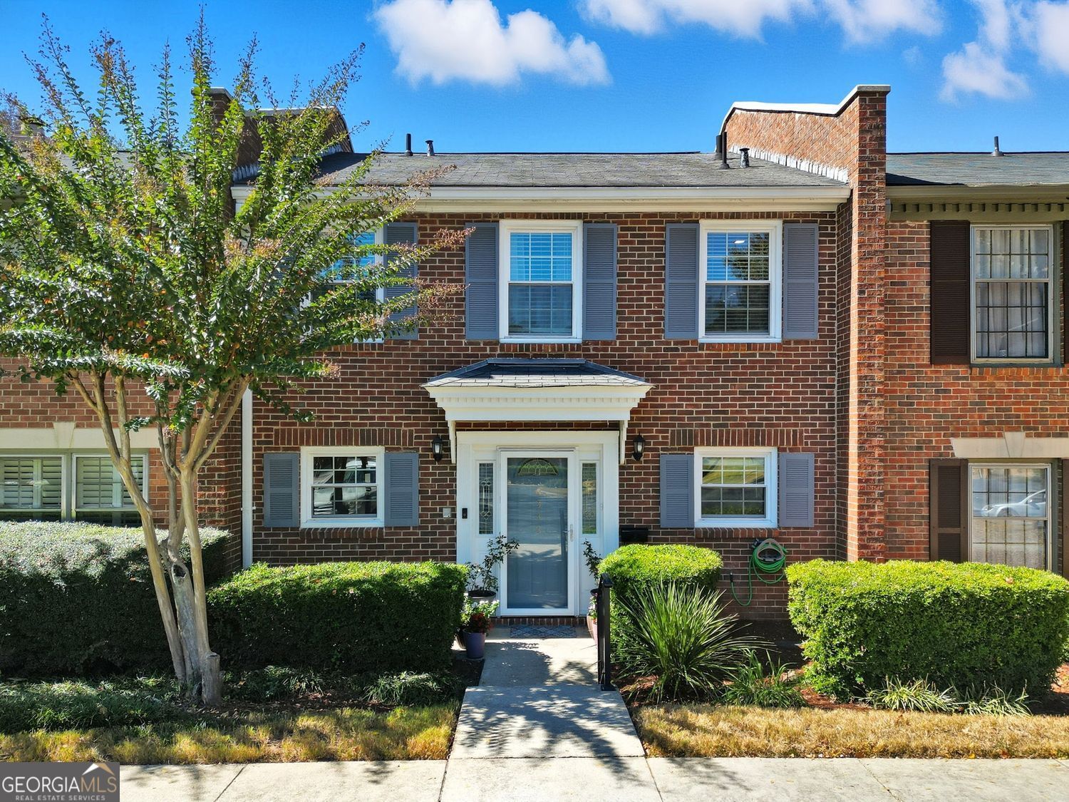 Welcome to this beautifully maintained 3BR/2.5BA townhome located in a quiet, boutique-style community in Decatur. Ideal as a primary residence or investment property, this home offers no rental restrictions, moderately priced HOA fees, and a location that puts you minutes from Downtown Decatur, Avondale Estates, the DeKalb Farmers Market, and just a short drive to Downtown Atlanta. Step inside to find tile and hardwood flooring on the main level, newer carpet upstairs, and updated kitchen and bathrooms. The kitchen features granite countertops, a tile backsplash, stainless steel appliances, and a built-in Miele coffee machine & bar. The spacious living room fills with natural sunlight and features a cozy wood-burning fireplace with built-in wall shelving The primary suite offers a tiled, seated shower and California Closet organization system. Additional highlights include newer windows throughout, a well-maintained HVAC system, laundry room with shelving and pantry space on the main level (washer, dryer, and additional freezer remain), separate dining area, fenced patio/terrace with storage, Larson security doors, and two assigned parking spaces with guest parking available. A new roof is being installed for the buyer's benefit. The community pool is a great bonus, and nearby shopping, restaurants, and daily conveniences round out the location benefits. Whether you're searching for a comfortable home or a smart investment, this well-maintained townhome delivers on value, convenience, and location.