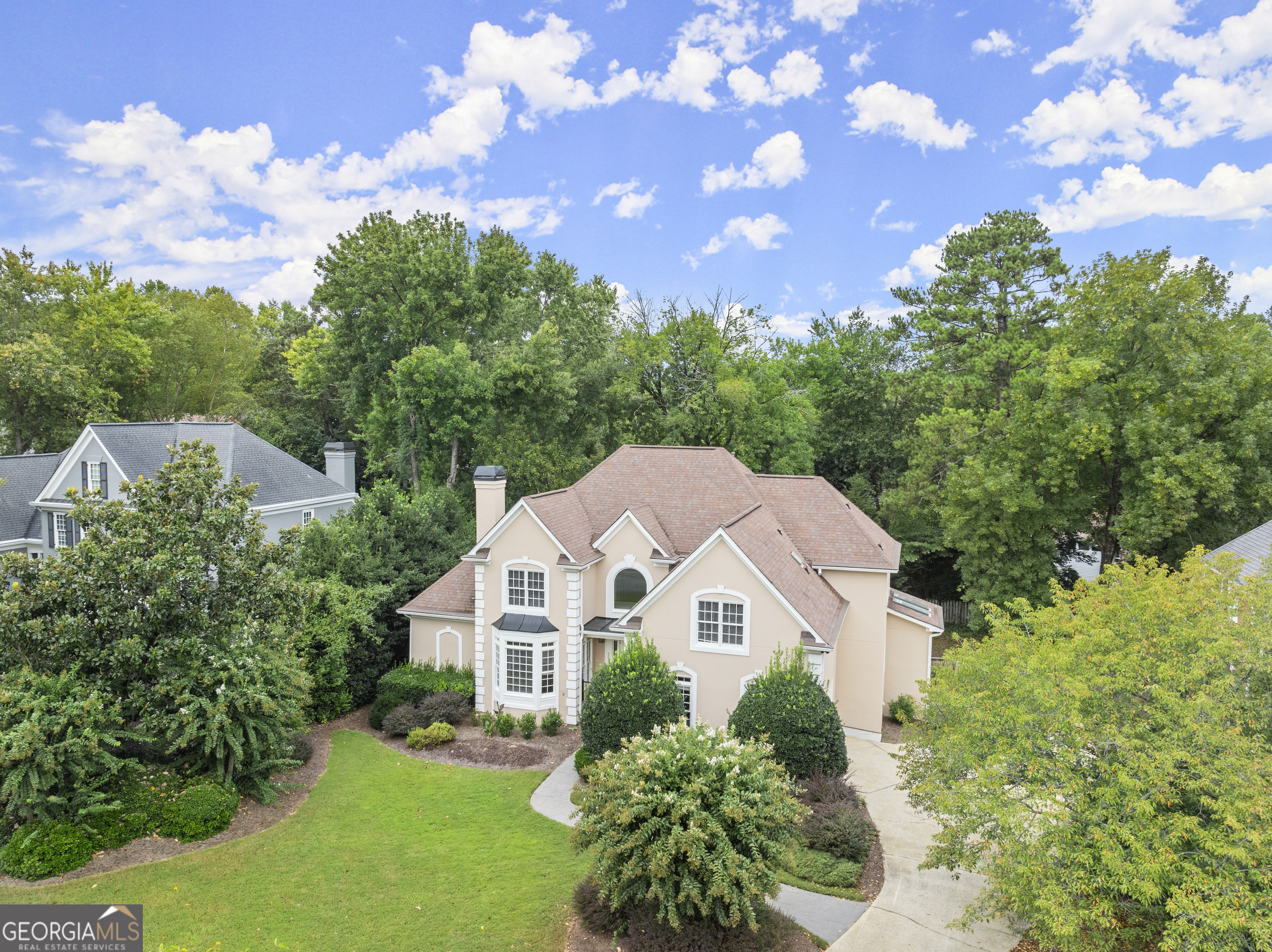 An East Cobb GEM! One of the largest homes to hit the market in this area. This beautiful home features amazing upgrades throughout the home. This home features an amazing 2 story foyer and a sprawling slightly spiraled staircase leading up to the 3 large bedrooms upstairs. Each bedroom upstairs has its own full bathroom and spacious closet space. The Master bedroom is on the main level, the only bedroom on the main level, that features a soaking tub, a large separate shower, and a custom closet perfect for a couple. The main level has marble floors at the entrance, and hardwood throughout the main level. The bedrooms upstairs have carpet that has been replaced in 2024. The basement is finished and is an additional 2500 sqft of living space that features 2 additional bedrooms, a full bathroom, a great room, an office, a Kitchen, dining room, storage, and more! As stated before, this is an East Cobb Gem. This is a quiet, well-established, and sought-after neighborhood. Perfect for a large family or a growing one, Sulky has all you could dream of.