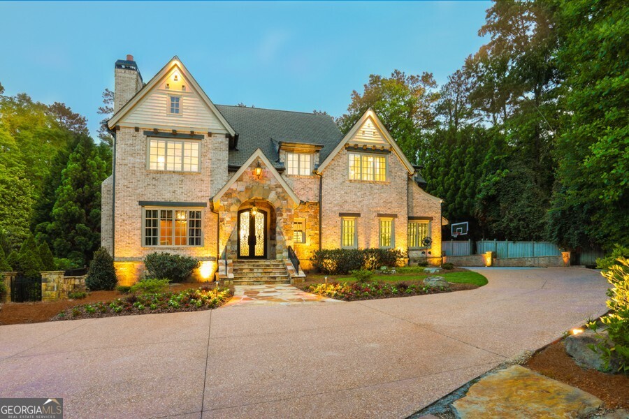 Live the Dream in Chastain Park! 4140 Hillside Place is tucked away in a private cul-de-sac with large Green space surrounded by stately homes. This home was custom built designed for both entertaining and relaxing lifestyle. The Gourmet kitchen is equipped with Viking 6 burner gas cook top and griddle, 3 ovens, 2 Asko dishwasher's and separate Sub-Zero Refrigerator and Freezer. Large Island opens to family room, breakfast room and newer vaulted fireside Sunroom all with pool views. The private resort styled backyard with walk out PebbleTec salt water pool & spa. Cabana and grilling station are flanked by a stone fireplace. Designated full pool bath and dressing area. All bedrooms are ensuites. Perfect location steps to Chastain Park, The Chastain Restaurant, golf course, Equestrian facilities and Chastain Park Pool with swim teams. Large finished terrace level with media, game area and bar. Plenty of extra storage room. Full bath and bedroom or gym. electric car charger recently added to 3 car garage with Epoxy floors. This home offers a very special private lifestyle.