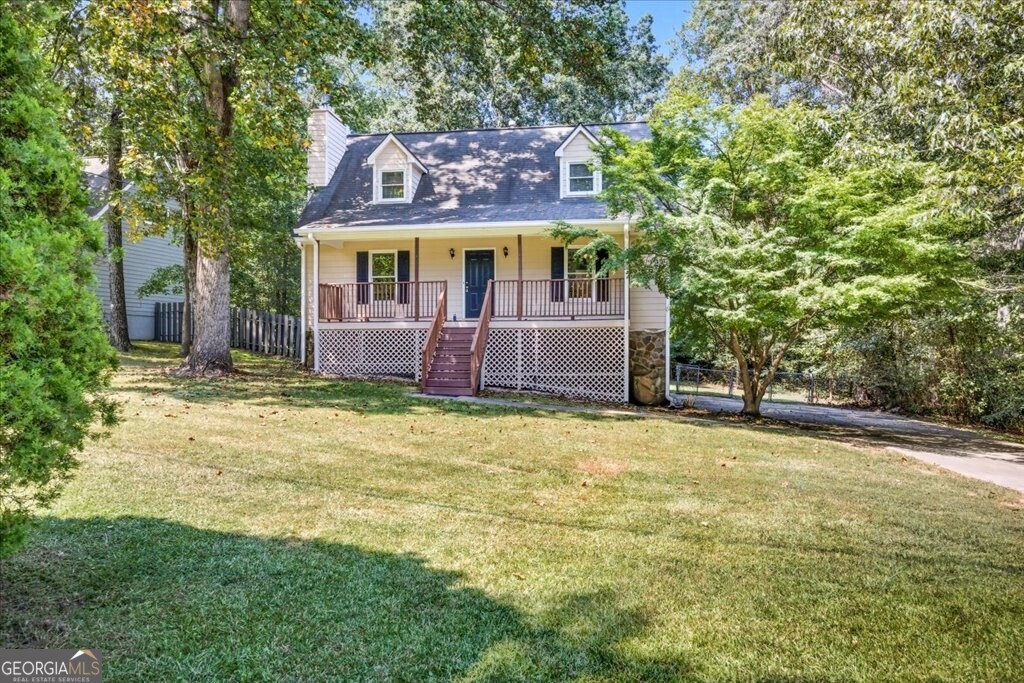 Charming Home in Sought-After Buford City Schools District Welcome to this beautifully updated home in a desirable Buford neighborhood, offering both character and modern comfort. Enjoy relaxing on the spacious rocking-chair front porch before stepping inside to a freshly painted interior with all-new flooring throughout. The main level features a primary suite, cozy living room with fireplace, kitchen, dining area, and a convenient half bath. Upstairs, you'll find two oversized bedrooms and a full bathroom, providing plenty of space for family or guests. The finished basement offers even more living flexibility with a bedroom, half bath, laundry room, additional living area, and a one-car garage. Outside, the large flat yard is perfect for pets, play, or entertaining. And within the next 30 days, a brand-new deck will be installed, adding the perfect spot for outdoor gatherings. With its updates, charm, and location in the award-winning Buford City Schools district, this home is a rare find!