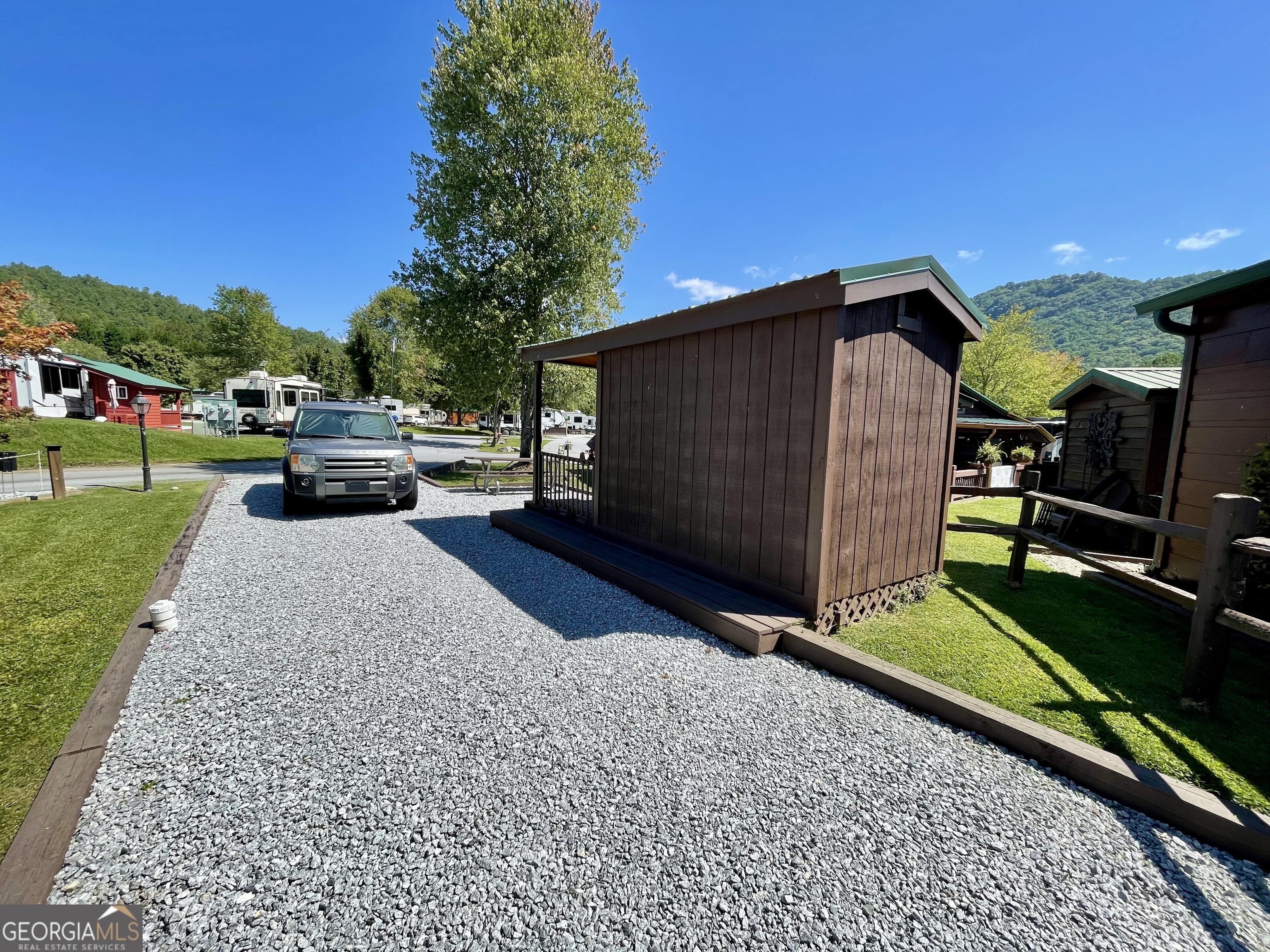 Great opportunity to purchase an RV space in the FALLS VIEW MOUNTAIN VILLAGE community! Use as a RV space or Put a Park Model on the Lot. Water/sewer/electricity available. Natural Gas is also at the lot line. Sit outside, relax, and enjoy the sounds of the water feature while taking in the mountain air & views!! All conveniently located near Dillard. Easy access. Falls View Mountain Village community shares the amenities with River Vista: Club House, Pool, Fitness Room, Playground, Dog Park & much more!! Must come see to appreciate the lifestyle available at the Falls View Mountain Village community. (NO RENTALS are allowed at FALLS VIEW MOUNTAIN VILLAGE).
