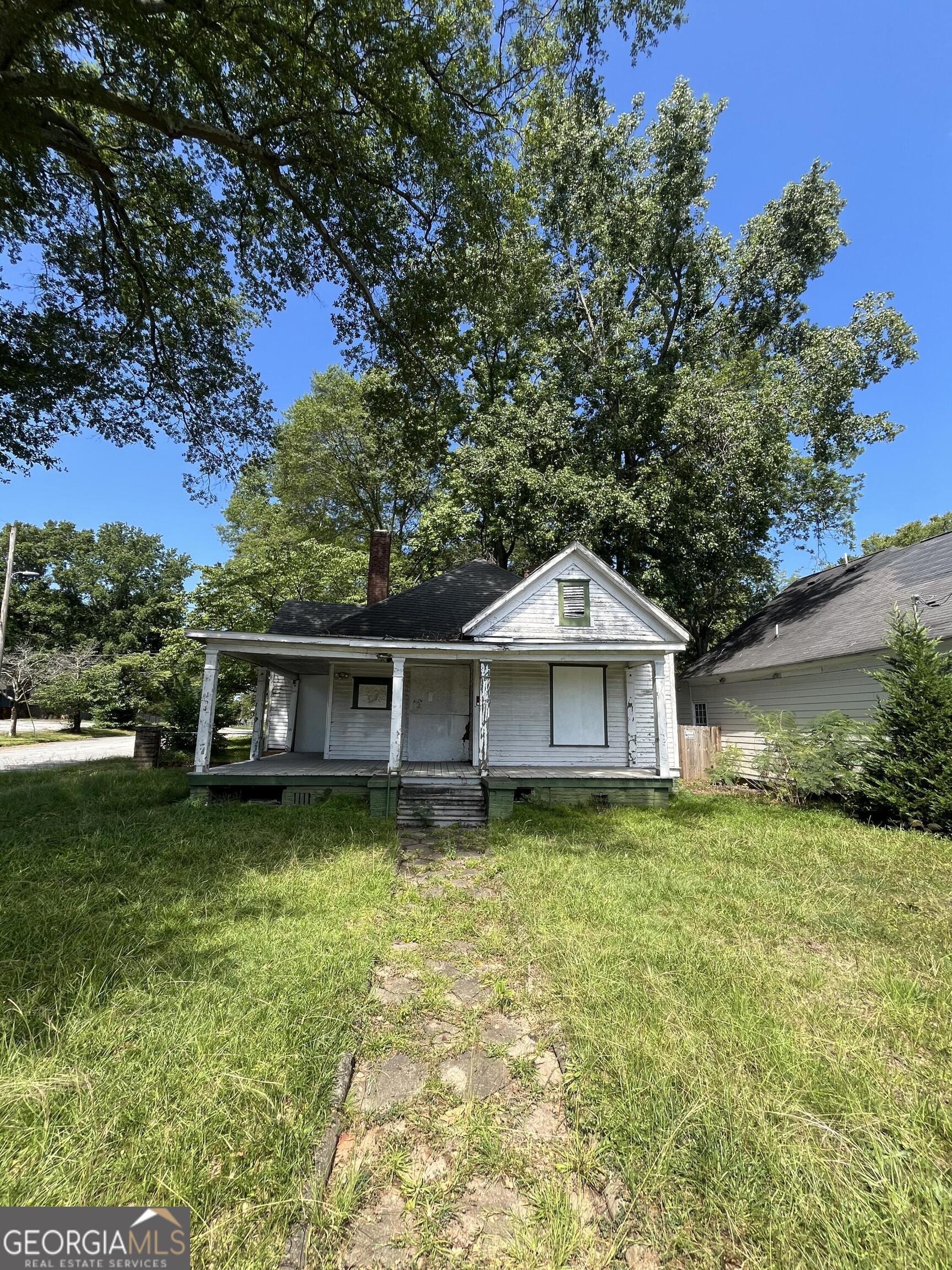 3045 Church St, East Point, GA 30344 - Exceptional Investment Opportunity Presenting a unique opportunity to acquire a versatile property in the desirable Center Park neighborhood of East Point. This 0.273-acre parcel features dual street frontage and includes an existing 2-bedroom, 1-bathroom home in need of renovation, offering substantial potential for both investors and homeowners. Property Highlights: Prime Location: Situated minutes from Tyler Perry Studios, Hartsfield-Jackson Atlanta International Airport, MARTA, and downtown Atlanta, this property is ideally positioned for convenience, transit, and future growth. Two-for-One Potential: The property's large lot size and configuration create the possibility to subdivide and develop two buildable lots (pending city approval), maximizing investment upside. Existing Structure: The current home offers a solid foundation for renovation or expansion. Ready for Development: Public water, sewer, and utilities already on site. R1 single-family zoning supports a variety of residential uses. Economic Incentives: Located within a Federal Opportunity Zone and East Point's Tax Allocation District, the property may qualify for significant tax benefits and development incentives. Active Community: Walkable to parks, schools, and popular local amenities. East Point continues to experience strong redevelopment and revitalization initiatives. This property represents a rare blend of established infrastructure, subdivision/development potential, and value-add renovation opportunity in one of Atlanta's up-and-coming markets.