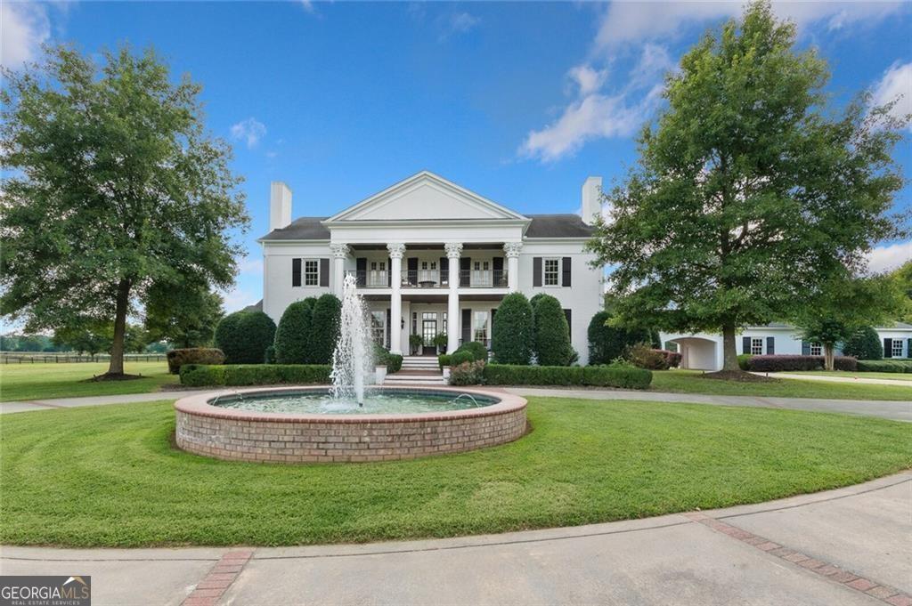 Amazing Equestrian Estate for the discriminating professional. You can live the dream in this truly magical property, but still be just minutes from I-75 and less than 70 miles from the Atlanta airport and 45 miles from Chattanooga airport. Regional airport within 5 miles also accommodates jets This property is "horse heaven" and features almost 90 acres of lush fenced and cross fenced pastures, 2 deluxe European style barns with a total of 30 stalls ,wash racks, hay storage, riding arena with irrigation system and round pen. Classically beautiful home is a masterpiece with unparalleled quality throughout and featuring breathtaking views from all aspects of the house with amazing sunrises/sunsets. Floor plan was designed to combine easy living with a sophisticated European flair and features huge French provincial kitchen with 2 islands, custom cabinets, luxury appliances & walk in pantry. On the main level you will find soaring 16 feet ceilings, a banquet sized dining room for all your holiday entertaining, great room, media room, keeping room office & game room. The second floor is serviced by an elevator and features two master suites with sitting areas, fireplace & guest bedroom ,sauna. 2 wells on property in addition to city water. Resort outdoor living in the pool area features an outdoor kitchen complete with a gas fireplace for all your alfresco dining needs. Lovely 3 bedroom 3 bath Guest House is included in the bedroom and bath count and overlooks the fully stocked pond with several garden areas and plenty of sunshine. Three car detached garage and additional 2 car attached, portico & additional parking pads for trailers & RV's