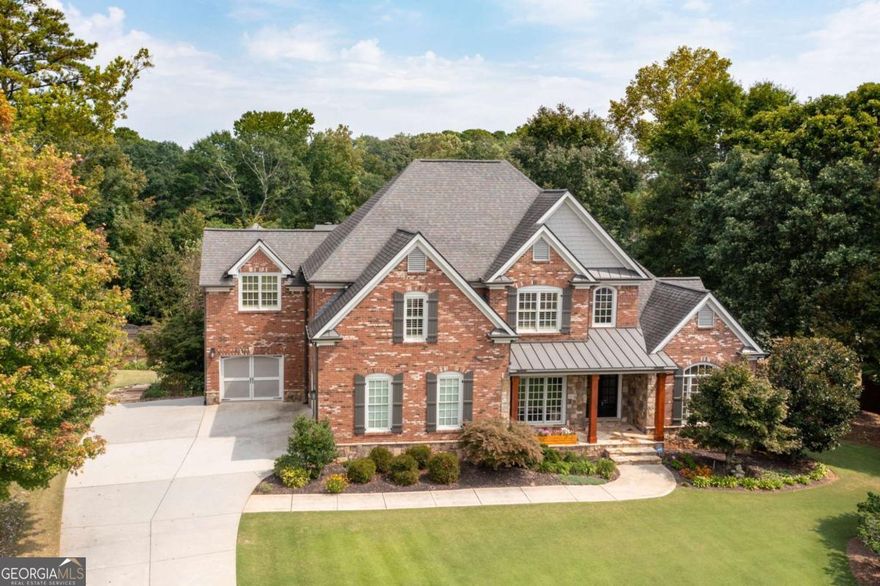 Stunning 4-sided brick East Cobb Estate in a Private 7-home Enclave with a 3-car Garage featuring an Epoxy Floor and Custom Hall Tree. A soaring 19-ft Foyer opens to a Coffered-Ceiling Living Room with one of three Gas Fireplaces. The Chef's Kitchen includes a large Built-in Pantry, Stainless Steel Refrigerator, Gas Cooktop with Telescoping Downdraft Vent, Double Oven, Dishwasher, & Microwave. The Breakfast Nook opens to a Screened, Covered Deck overlooking the Landscaped Backyard with Irrigation, a Flagstone Patio, built-in Gas Firepit, & Fenced Vegetable Garden. There's even a cute Putting Green-Perfect for Golf Enthusiasts to Practice their Short Game. The Main-Level Primary Suite features a Sitting Area, Fireplace, Spa-inspired Bath, & Walk-in Closet with Built-ins. Upstairs offers a Bonus Room plus Four Bedrooms, including a Teen Suite with Flex Space & a Secret Room-can you find it? The Unfinished Basement is Stubbed for a Bath & ready for your vision. Smart Home Features control Lights, Blinds, Security, Sprinklers, Thermostats, & Leak Detection. Enjoy access to nearby Swim/Tennis Clubs & Top-Rated Mountain View, Hightower Trail, & Pope Schools-Don't Miss this One!