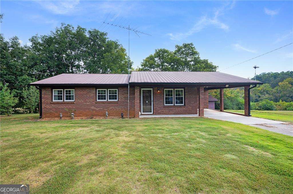 Nestled in a peaceful country setting, this well-maintained 3-bedroom, 2-bathroom home offers timeless charm. Built in 1983, the home retains its original character with important improvements, including updated insulated windows, HVAC, water heater, and septic field lines-ensuring peace of mind for years to come. Inside, the floor plan provides space for comfortable living and an opportunity for personal updates to reflect your style. The property's outdoor features shine, with a storage shed and an additional outbuilding complete with a concrete floor and electricity-perfect for hobbies, storage, or a workshop. Situated on a spacious .7-acre lot, the setting provides the quiet beauty of country living with room to garden, play, or simply relax and enjoy the outdoors. If you're looking for a home that offers both value and potential in a serene setting, this property is ready to welcome you.