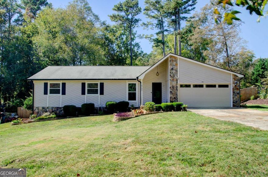 Enjoy coming home everyday to 4799 North Trail, featuring single level living with a backyard oasis and beautiful sunroom. Discover the perfect blend of comfort and convenience in this move-in ready 3-bedroom, 2-full-bath ranch home, nestled in sought-after East Cobb. Perfect for families, professionals, or empty-nesters alike. The heart of the home is the expansive great room, featuring LVP floors, a vaulted ceiling, and a cozy fireplace perfect for chilly winter evenings. Elegant wainscoting, fresh interior paint and new carpet in the bedrooms create a polished yet welcoming vibe throughout. Adjacent to the kitchen, the glass enclosed sunroom offers a bright and airy place to lounge while overlooking the deck and pool. The outdoor space features an above-ground saltwater pool and a deck encircling half the pool, making for an ideal gathering spot for barbecues and hosting family & friends for game day. The quarter-acre lot allows for this backyard oasis while retaining a spacious, fenced-in, landscaped yard for kids and pets. North Landing also offers a VOLUNTARY homeowners association with swim/tennis/pickleball, a clubhouse, 14-acre lake for fishing and an 18-hole disc golf course. Book your showing today!