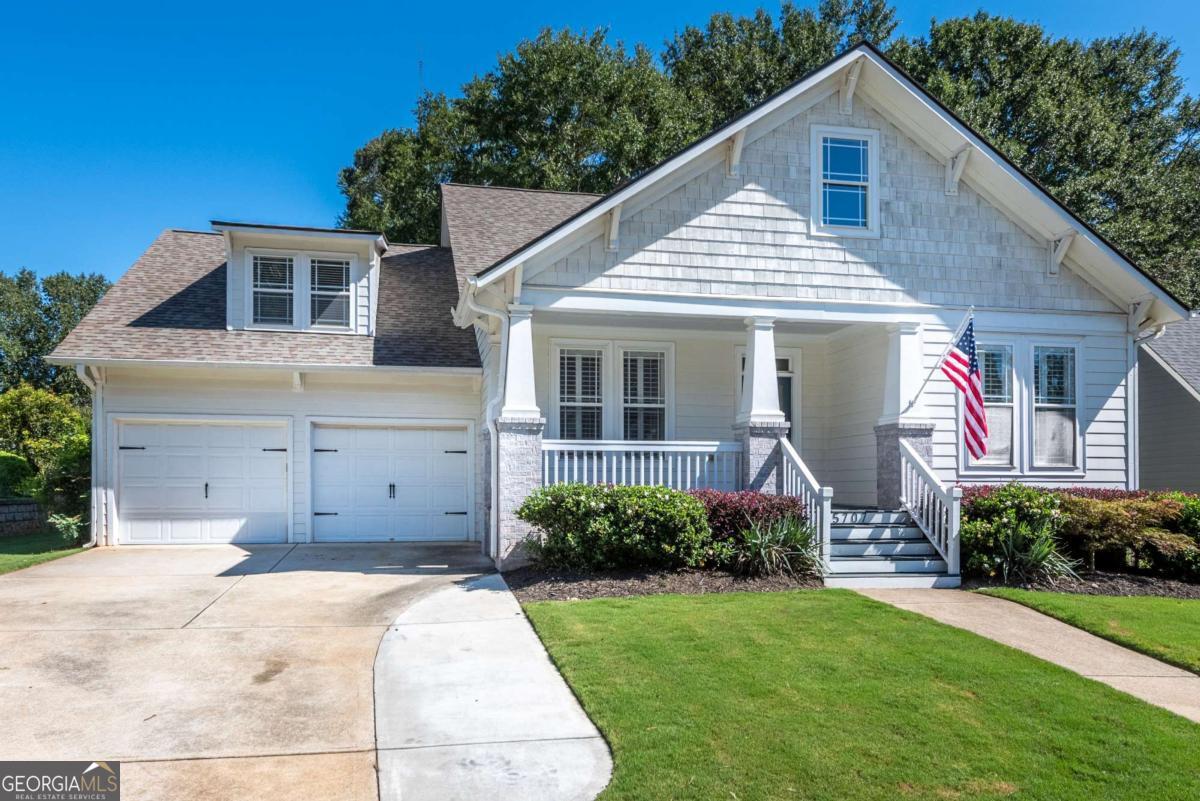 4 BR / 3 BA Craftsman style ranch in the Reunion golf course community! This John Weiland home has the primary bedroom on the main and a split bedroom floor plan. The kitchen features white cabinets with granite countertops, stainless appliances and view to the living room. Hardwood flooring throughout with tile in the bathrooms. Spacious living room with gas log fireplace. Bonus teen suite/2nd family room on the 2nd level complete with full bathroom. Additional room for expansion is available on the 2nd floor. Easy to maintain landscaped front/back yard with a rocking chair front porch and back deck.