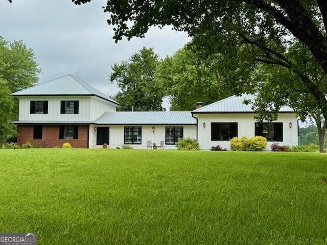 OWN A SLICE OF COUNTRY PARADISE!! WELL-MAINTAINED RENOVATED FARM HOUSE NESTLED ON 19.6 ACRES OF GENTLY ROLLING PASTURES WITH SHADE TREES IN SOUGHT AFTER BROOKS! **Heart of pine floors and plantation shutters throughout the home. **Custom Kitchen with old heart pine cabinets, center island & SS appliances, 5 burner gas top stove. **Gorgeous granite counters & subway backsplash + unique scrolled hardware. **Open Dining Room off Kitchen is the center of the home. **Cozy Family Room with built-ins on each side of traditional wood burning Fireplace. **Expansive Owner's Suite on Main features 2 walk in closets, niches & linen closet. **Luxurious Bathroom with oversized tile shower, upgraded faucets & fixtures, double vanities, linen tower and granite counters. **Private office on main. ** Tiled Mudroom contains laundry area and half-bath. **Unique second story addition features 2 bedrooms, gorgeous full bathroom & large Artist's Studio w/ sink! Bright windows showcase the rolling acreage and offer lots of inspiration for your creative side! Plus plenty of room to convert to a bedroom if needed. **Basement features Craft Room/Bedroom, Rec Room, full Bathroom, Storage & Utility Rooms. **Enjoy the picturesque views from the spacious screen porch that opens to deck, fenced backyard, fire pit and covered outdoor grilling area. **Plenty of workshop & storage space with 2 - two car garages, offering 4 parking spots for equipment or cars. Fenced pastures, blueberry bushes, pear and pecan tree. Pole barn, chicken coop & storage building, ready for your mini farm...Bring the horses, chickens, RV & 4 wheeler! **Home features Rinnai hot water heater & 500 gallon propane tank. ** Exceptional Fayette County schools, 10 minutes to both Peachtree City and Fayetteville. Quick access to Atlanta & Airport. Home is in Restrictive Covenants of Land Use.