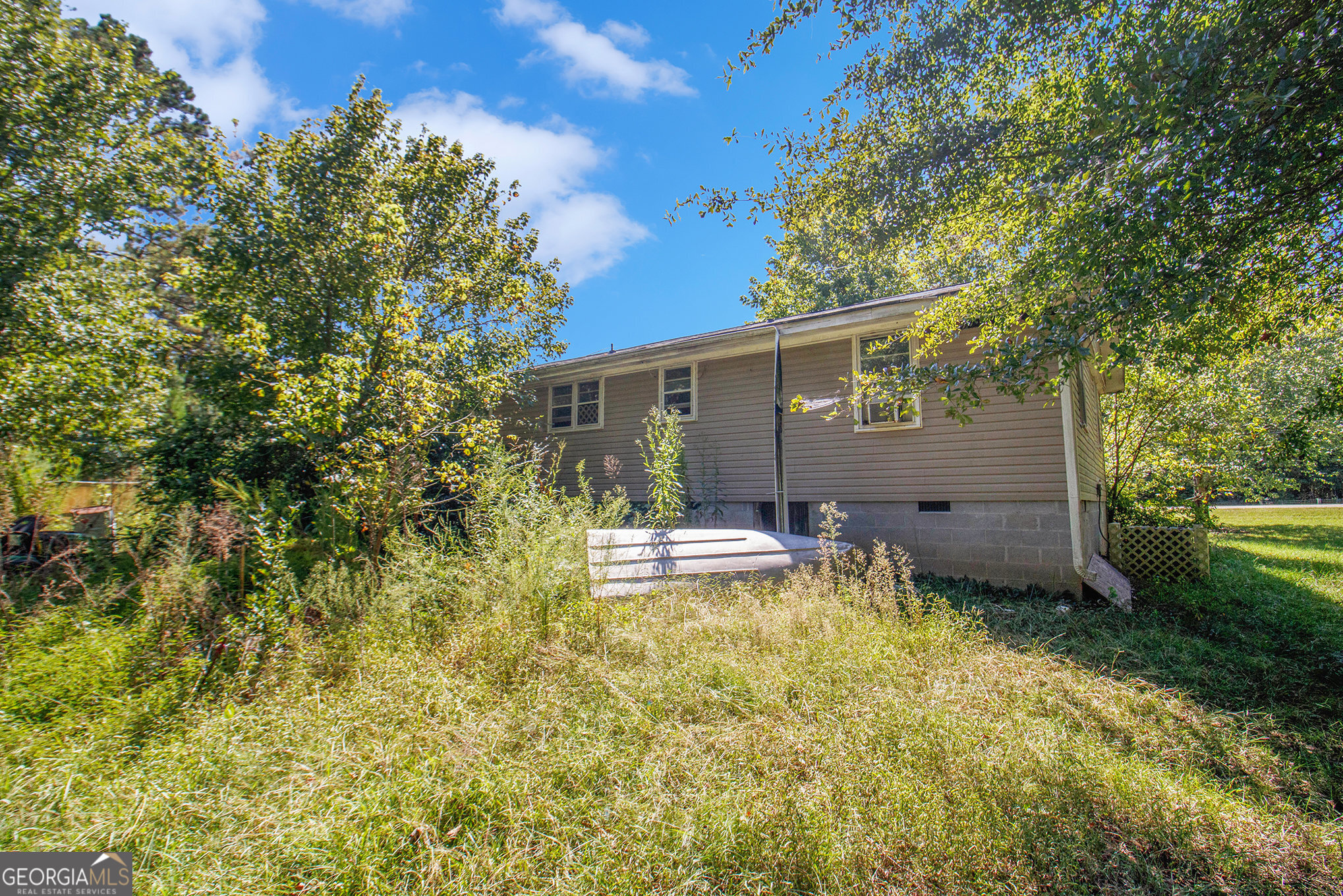 Welcome to 1555 Straylott Rd in Franklin, GA! This property offers an incredible opportunity whether you're searching for your next great investment or a forever home to put your own personal touch on. The home features 3 bedrooms and 2 bathrooms with approximately 1,586 sqft of living space, offering plenty of room for family and guests. Sitting on 5 acres, the property provides privacy, space for outdoor enjoyment, and endless possibilities for gardening, recreation, or even future expansion. Inside, you'll find a layout with strong potential ready for your updates, renovations, and vision to bring it to life. With some TLC, this home can truly shine and become a long-term value-add for the right buyer. Located just minutes from downtown Franklin, schools, shopping, and dining, yet tucked away in a peaceful setting, this home offers the best of both worlds: convenience and privacy.