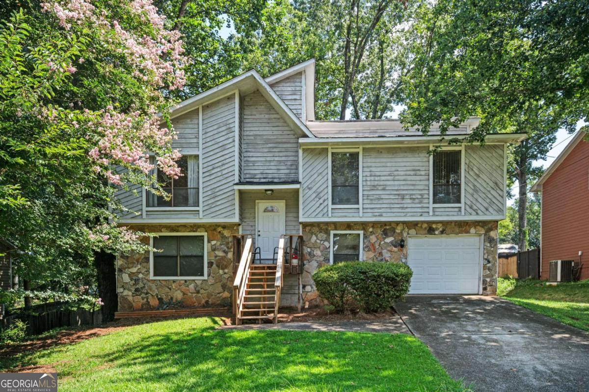 Opportunity knocks in Lilburn! Discover the perfect blend of space, convenience, and potential in this spacious 4-bedroom, 2-bath split-level home that features a flexible floor plan, great for families ready to build their next chapter or savvy investors seeking a smart portfolio addition. Enjoy two outdoor decks-including one brand-new-and a large backyard just right for entertaining or relaxing. Located near dining, shopping, and I-85 with No HOA. Priced below market value to reflect future improvement needs-like flooring and cosmetic updates-this property is packed with possibilities and ready for your vision. Whether you're customizing your dream home or expanding your investment portfolio, this one checks all the boxes. Don't miss out-Schedule your showing today. Seller prefers all potential buyers tour the home prior to putting in an offer to purchase.