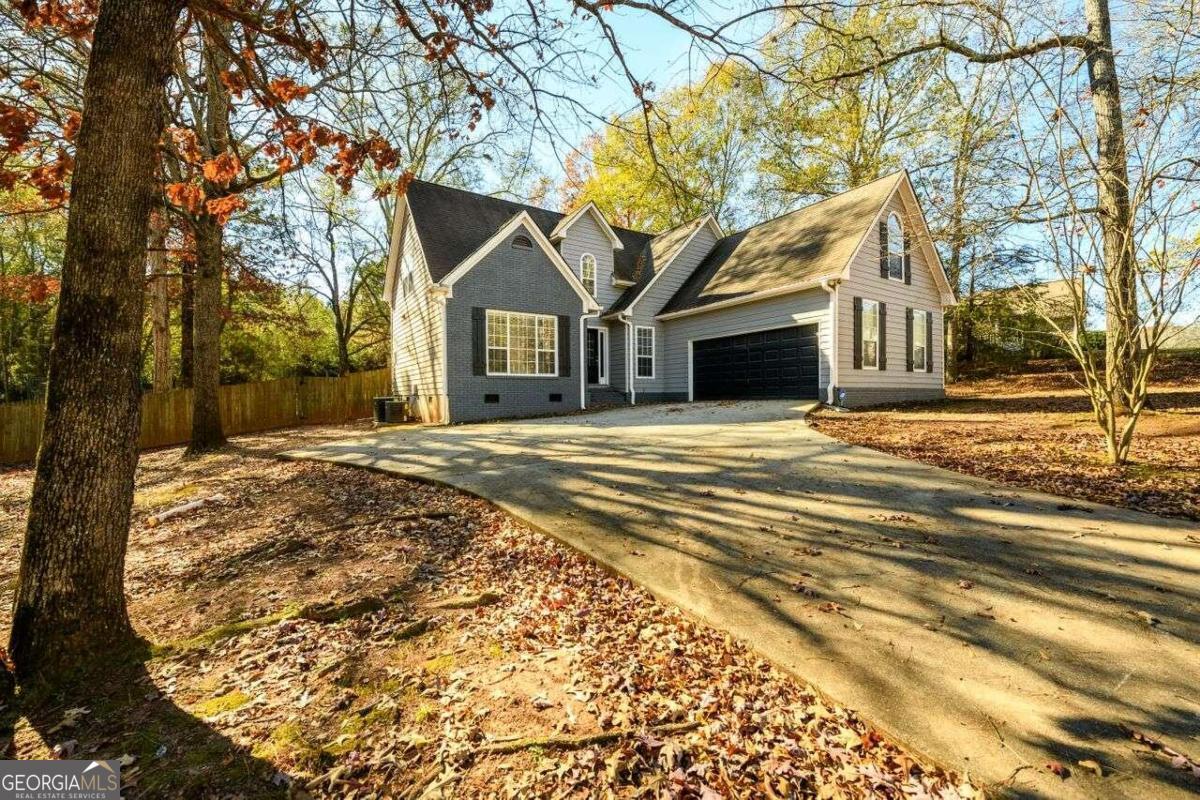 Beautiful 4 bedroom 2 1/2 bath home with Smart Home technology! This beautifully renovated home has a contemporary style. The Kitchen includes beautiful Quartz countertops, white cabinets and stainless steel appliances. The large master bedroom on the main floor has tile bathroom floors, Quartz double vanity, garden tub and separate tiled shower. Wood stairs to the second level lead to 3 additional bedrooms upstairs with a large guest bathroom. Entertaining never been easier with this beautiful interior floorplan, extended back deck and large in-ground pool!