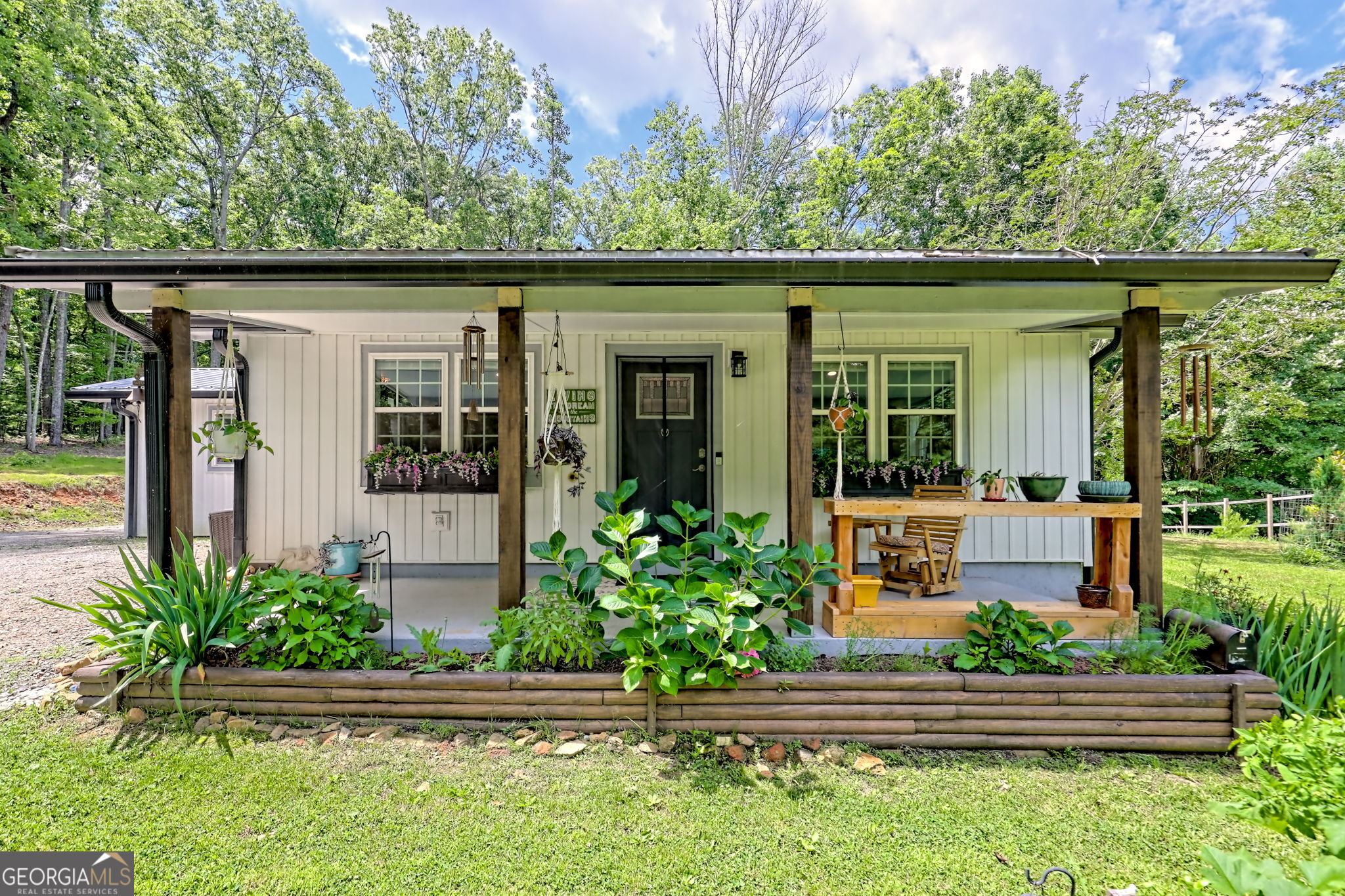 2 Lots with UNRESTRICTED acreage and connected to US Forestry Service Land! Escape to your own private retreat! This fully remodeled 2BR/1.5BA one-level home sits on 4.47 unrestricted acres in a park-like setting offering peace, privacy, and endless outdoor adventures. Renovated and re-piped in 2022 with new HVAC, water heater, flooring, and stylish finishes throughout. The open-concept main living area features vaulted ceilings with faux beams, an oversized marble island, brand-new cabinetry, and natural light from large windows. Enjoy seasonal mountain views from the back deck and covered front porch and tend to your own gardens. Take advantage of the 12x20 shed for storage or hobbies. Property is gated and private with a remote controlled automatic entrance-a perfect blend of comfort, seclusion, and access to nature!