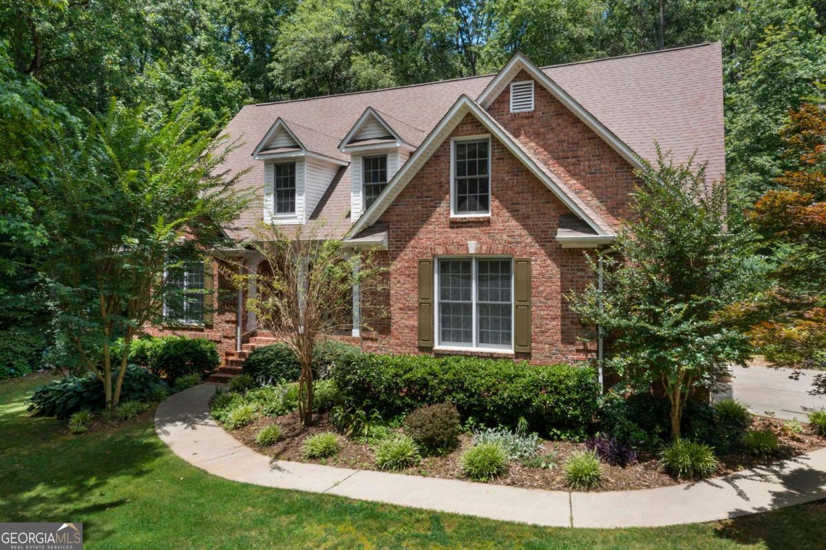 Custom Built Estate Home on 5 Acres of Private, Serene Living Discover the perfect blend of luxury, comfort, and privacy in this stunning custom-built home nestled on a professionally landscaped 5-acre estate lot. From the moment you step onto the welcoming front porch and into the grand foyer, you'll be captivated by the elegant design and thoughtful layout. The spacious living room flows seamlessly into a recently renovated kitchen that's a true chef's dream. Featuring custom quartz countertops, high-end stainless-steel Bespoke appliances, under-cabinet lighting, and an expansive butler's pantry with additional storage and prep space. Whether you're entertaining guests or enjoying a quiet night in, this kitchen is designed to impress. The adjoining breakfast area offers additional seating and the perfect natural lighting looking out to the private backyard retreat. This home offers a versatile layout with ample space to live and grow. The finished lower level includes a private bedroom, full bath, and dedicated office space. Ideal for guests, remote work, or a multigenerational setup. Unfinished areas provide incredible potential for expansion, a home gym, theater, or additional storage. Step outside and fall in love with the tranquil outdoor living spaces. Burst of color will delight you with every season. Enjoy morning walks on your private trail winding through the property or design the backyard oasis of your dreams. There's plenty of room for a pool, patio, and garden. All this peaceful, nature-filled living comes with the convenience of being just minutes from highways, top-rated dining, schools, shopping, and everyday essentials. Don't miss this rare opportunity to own a one-of-a-kind home in an exclusive, sought-after community. Your dream estate awaits.