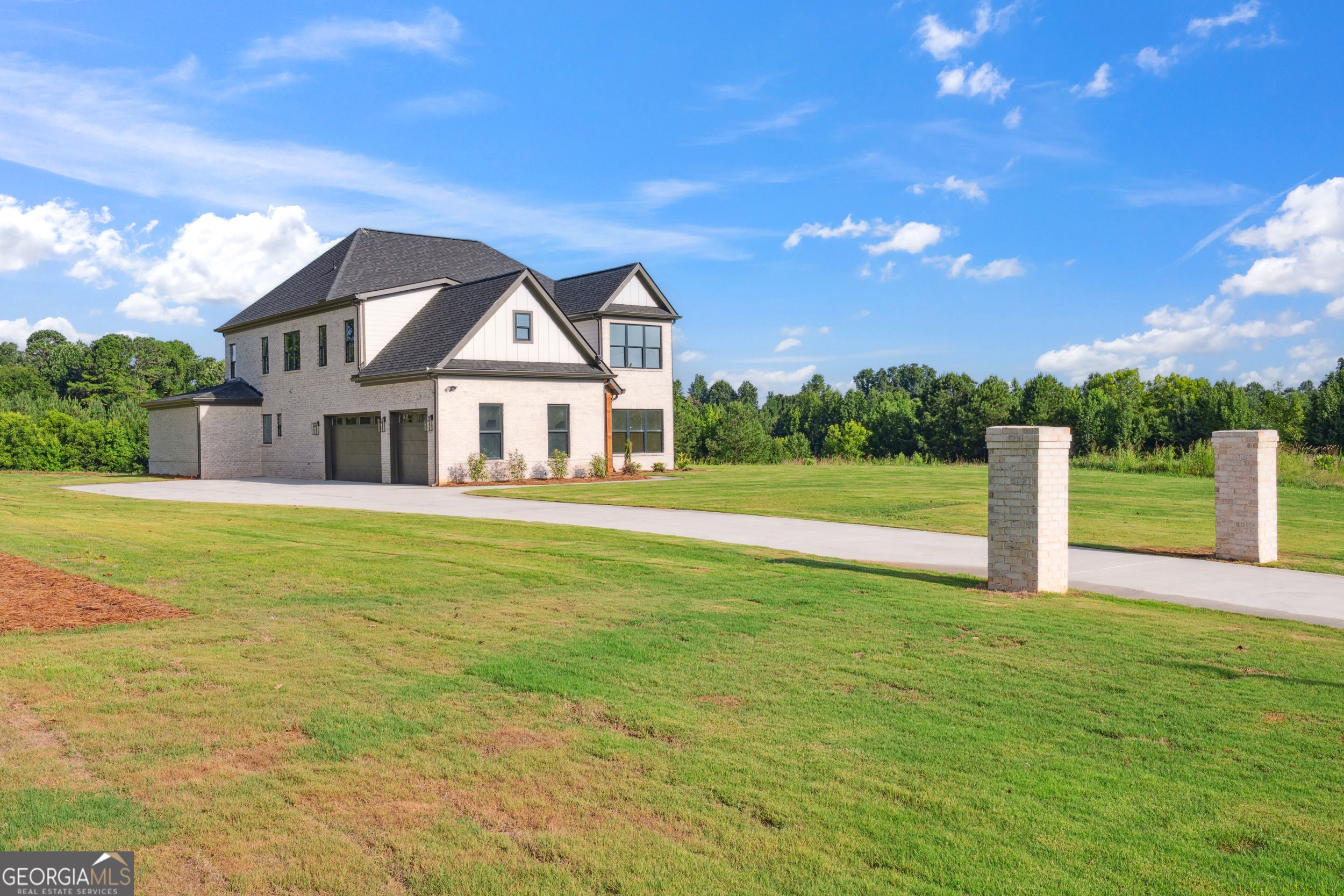JEFFERSON CITY SCHOOLS! This brand-new custom estate defines refined living-expertly built with high-end finishes, thoughtful design, and total freedom on 3+ acres with no HOA. Enjoy the privacy of country living paired with upscale features and award-winning Jefferson schools. Inside, nearly 4,000 sq ft of luxury welcomes you-soaring ceilings, rich hardwoods, upgraded windows, and detailed trim. The chef's kitchen features custom cabinetry, quartz counters, high-end appliances (complete with matching 48 inch fridge), a huge pantry with coffee bar, and a massive island. Each bedroom includes a private bath and custom closet built-ins-no wire shelves here. The spa-like primary suite offers a soaking tub, frameless glass shower, dual vanities, and two walk-in closets with full custom shelving. Upstairs: 3 oversized bedrooms, a media room, home office, and a second laundry room. Outside, bring your RV or boat-the oversized concrete pad is ready. Want a pool? Detached garage? Garden? You've got the space and freedom to do it all.