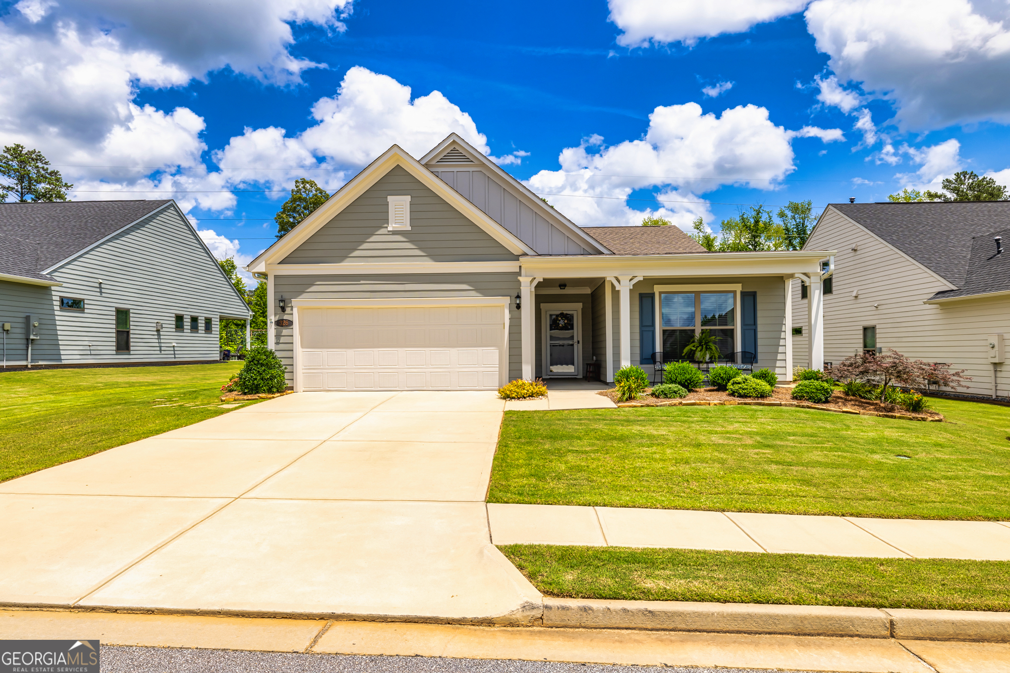 Located in the highly desirable Everton Villages subdivision in Peachtree City, this move-in ready 3 bed, 2 bath ranch offers 2,020 sq ft of stylish, single-level living. Built in 2020, the home features wide plank engineered hardwood flooring throughout an open-concept layout that seamlessly connects the living, dining, and kitchen spaces. The kitchen is a chef's dream with quartz countertops, white soft-close cabinets, gas cooktop, upgraded exhaust hood, island with bar seating, pantry, and coffee bar. The gathering room includes a cozy gas log fireplace with electric starter, while a separate office or sitting room adds flexibility. The spacious primary suite is tucked at the back with views of the beautifully landscaped, fenced yard and includes a double vanity, oversized tile shower, and custom walk-in closet. A guest bedroom and hallway bath are ideally located at the front for added privacy, along with a 3rd bedroom. Enjoy year-round comfort in the sunroom, or relax outdoors on backpatio surrounded by mature landscaping. Upgrades include a whole-home surge protector, hot water sensor, sprinkler system, and enclosed garbage area. Neighborhood amenities include TWO pool, FOUR tennis courts, 4 pickleball courts, playground, and a clubhouse-all just minutes from Peachtree City's shopping, dining, and golf cart paths.
