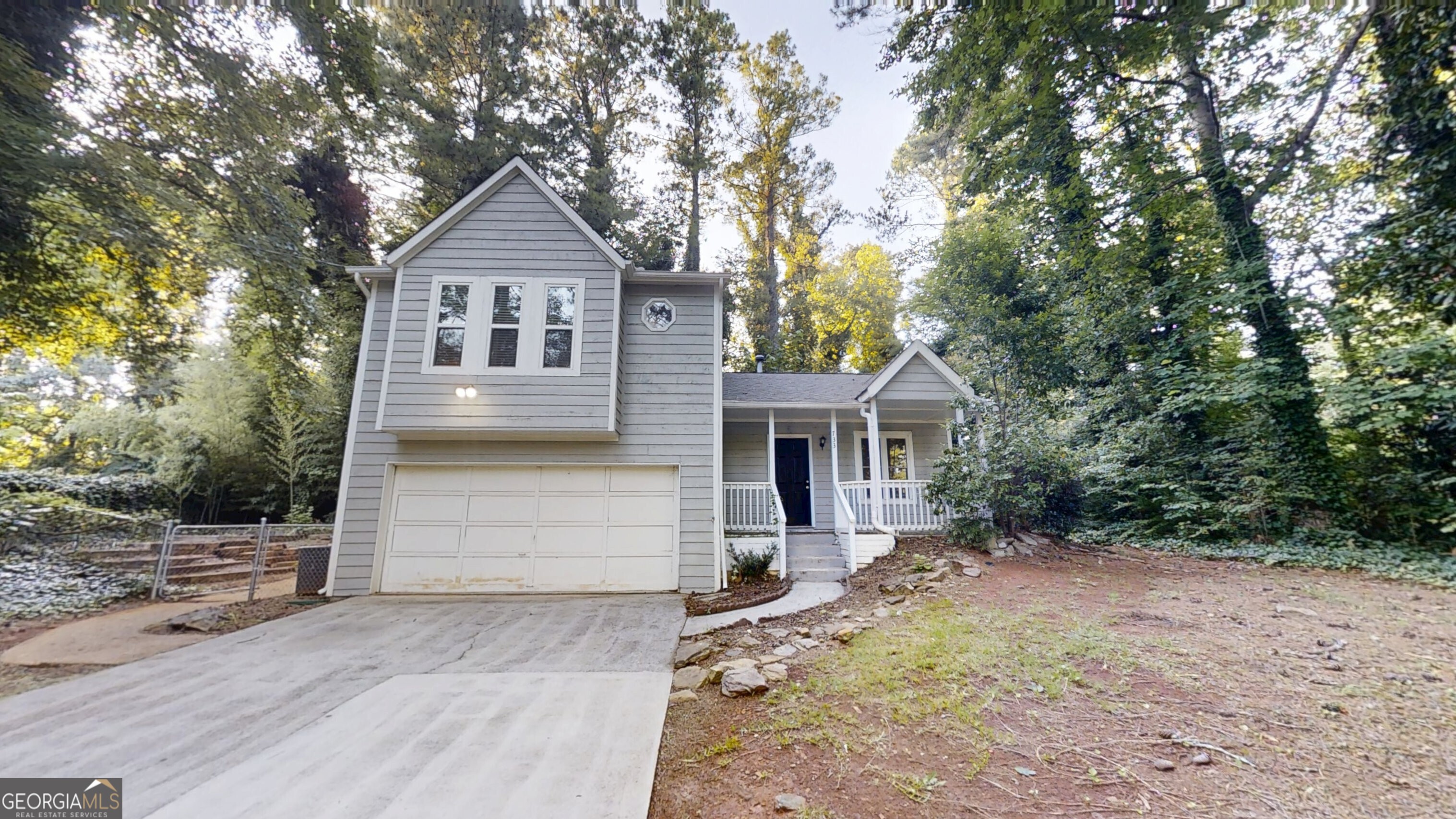 Welcome to this beautiful 3-bedroom, 2-bath split-level home in the desirable Emerald Forest neighborhood! Featuring durable LVP flooring throughout the main living areas and cozy carpet in the upstairs bedrooms, this home offers both comfort and style. Fresh paint throughout. The inviting family room boasts a cozy fireplace, perfect for relaxing evenings. The kitchen is equipped with crisp white cabinets, stone countertops, and stainless steel appliances ready for your next meal or gathering. The spacious primary bedroom is part of a smart split-bedroom plan that offers privacy and flexibility. Step outside to a large, fenced-in backyard with a rear patio ideal for outdoor entertaining, play, or simply relaxing. Conveniently located near major highways, shopping, and dining, this home combines quiet suburban living with easy access to everything you need. Don't miss the opportunity to make this well-maintained gem your new home!