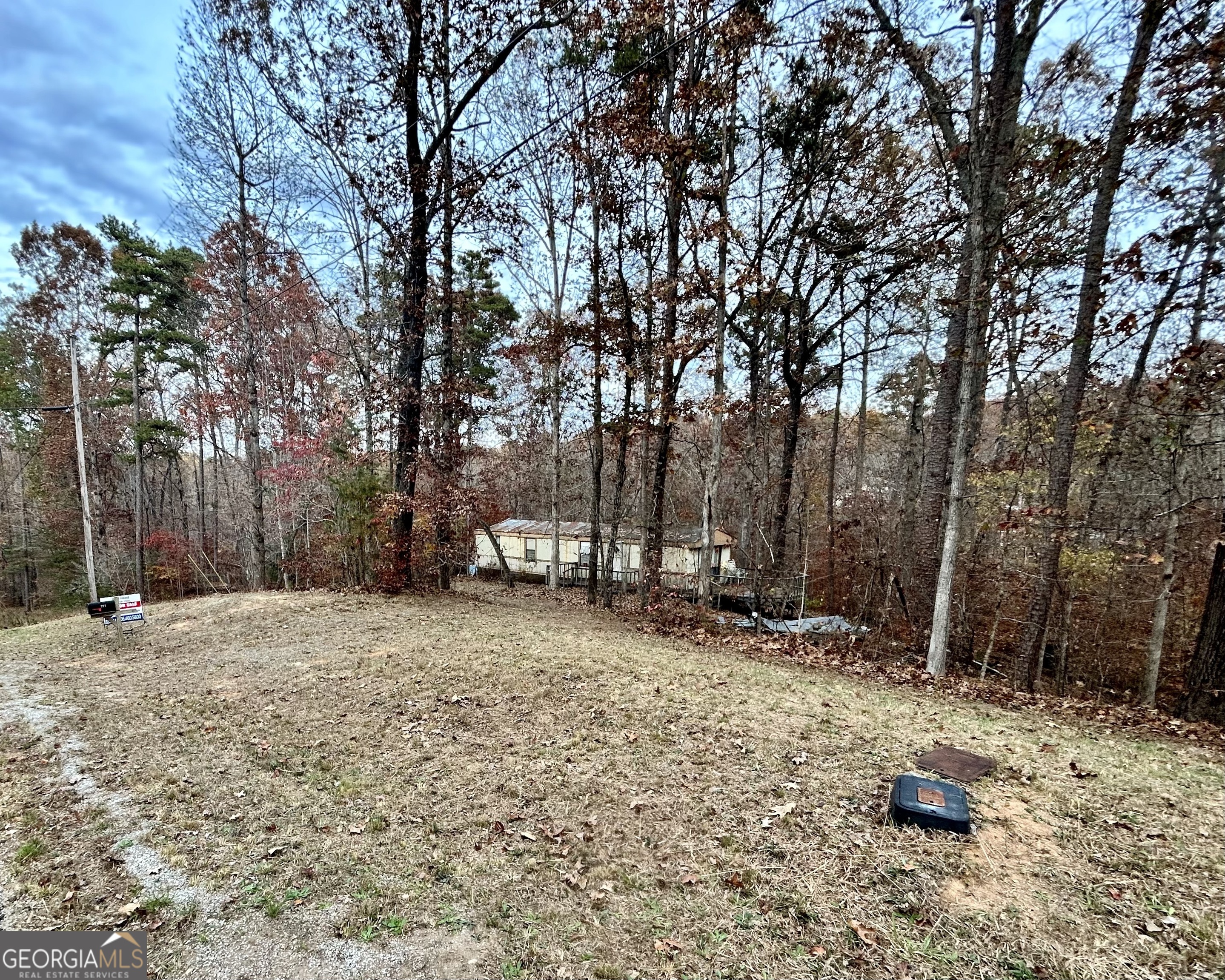 Affordable lots in Lake Hartwell community! Property currently has a mobile home in place that will convey with sale. Septic and public water already in place. Sale includes three lots. Community amenities include swimming pool, dock, and boat launch.