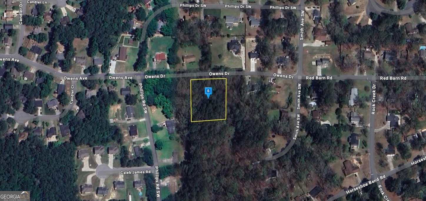 Excellent opportunity to own a 0.91-acre vacant lot in Cobb County, GA. Conveniently located near top dining, shopping, and entertainment at Town Center, Marietta Square, and The Avenue West Cobb, with easy access to I-75 via Barrett Parkway. This property features beautiful views, mature trees, and paved road access ideal for anyone seeking comfort, style, and convenience in a top-rated school district. Listing is for land only and sold As Is. Whether you're ready to build now or invest for the future, this is a rare find in a prime location don't miss out! I MAKE IT MY POLICY TO PUT ALL KNOWN INFORMATION ABOUT EACH LOT IN THE WRITE UP DETAILS, SO IF YOU DON'T SEE THE ANSWER YOU'RE LOOKING FOR , PLEASE CONTACT THE COUNTY TO GATHER INFORMATION.PLEASE UNDERSTAND WHEN BUYING OR SELLING VACANT/RAW LAND THIS IS USUALLY THE CASE. THE LISTING AGENT DOES NOT GUARANTEE THE ACCURACY OF THE INFORMATION IN THIS LISTING AND IS TO BE HELD HARMLESS OF ANY MISREPRESENTATION. BUYERS ARE ENCOURAGED TO DO THEIR OWN DUE DILIGENCE TO MAKE SURE THE LOT IS A GOOD FIT. SELLERS HAVE STATED THAT THEY WISH TO SELECT THE TITLE AGENCY FOR CLOSING. THEY ARE WILLING TO COVER THAT COST AT CLOSING. THANK YOU FOR LOOKING. THIS IS A FLAT FEE LIMITED-SERVICE LISTING.