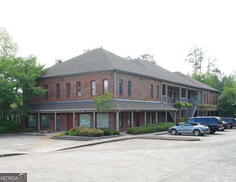 Spacious ground floor 980 sq ft. unit available for sale or lease. This suite provides six offices, including an oversized reception office with a large closet, as well as a spacious reception/waiting area, a kitchenette, wet bar and restroom. It boasts newly installed ceramic plank tile in the main common areas and two back offices with carpet in remaining offices. High-speed cable internet (Charter Cable) and television cable wiring pre-installed. Featuring plentiful drive-up parking, it is conveniently located in Roswell just off Holcomb Bridge Road near GA 400 in a high volume commercial area with monument signage available. Call today to schedule your viewing!