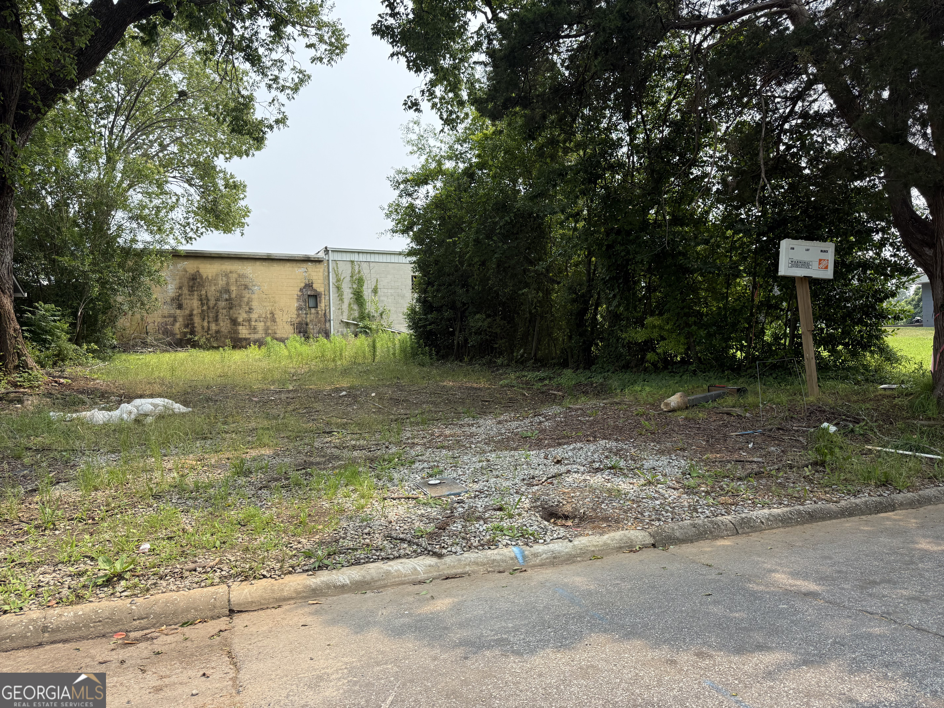 Located just minutes from downtown Griffin, this lot offers convenient access to shopping, dining, and a variety of local activities. The area is experiencing exciting growth, with several new construction projects underway nearby. The lot has been cleared out an is ready for its next owner. This is a great opportunity to build in a developing neighborhood with strong potential.