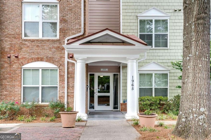 Welcome home to this stunning, spacious and freshly painted second-floor 3-bedroom, 2-bath corner unit condo, perfectly situated near downtown Alpharetta and the vibrant Avalon area. Enjoy the convenience of walking to AmerisBank Amphitheatre, Fetch Dog Park, Alpharetta Greenway, and easy access to Northpoint Parkway Shopping Area, GA 400, and the Alpha Loop. The modern warm kitchen boasts ample stained cabinetry, under cabinet lighting and black appliances opening to the generous dining and living areas, ideal for entertaining. Luxurious vinyl plank flooring runs throughout the living and bedrooms, complemented by ceramic tile in the bathrooms and new carpet in the bedrooms and family room. The bright family room extends to a covered balcony with a serene view of trees, creating a peaceful retreat. The thoughtful split bedroom floor plan features large walk-in closets, with the main suite offering double vanities, a garden tub, and a shower. This secure access building includes an elevator for convenience. Excellent community amenities feature a pool, assigned resident parking, plentiful guest parking, and professional landscaping. This condo combines a prime location with modern comforts, making it the perfect place to call home.