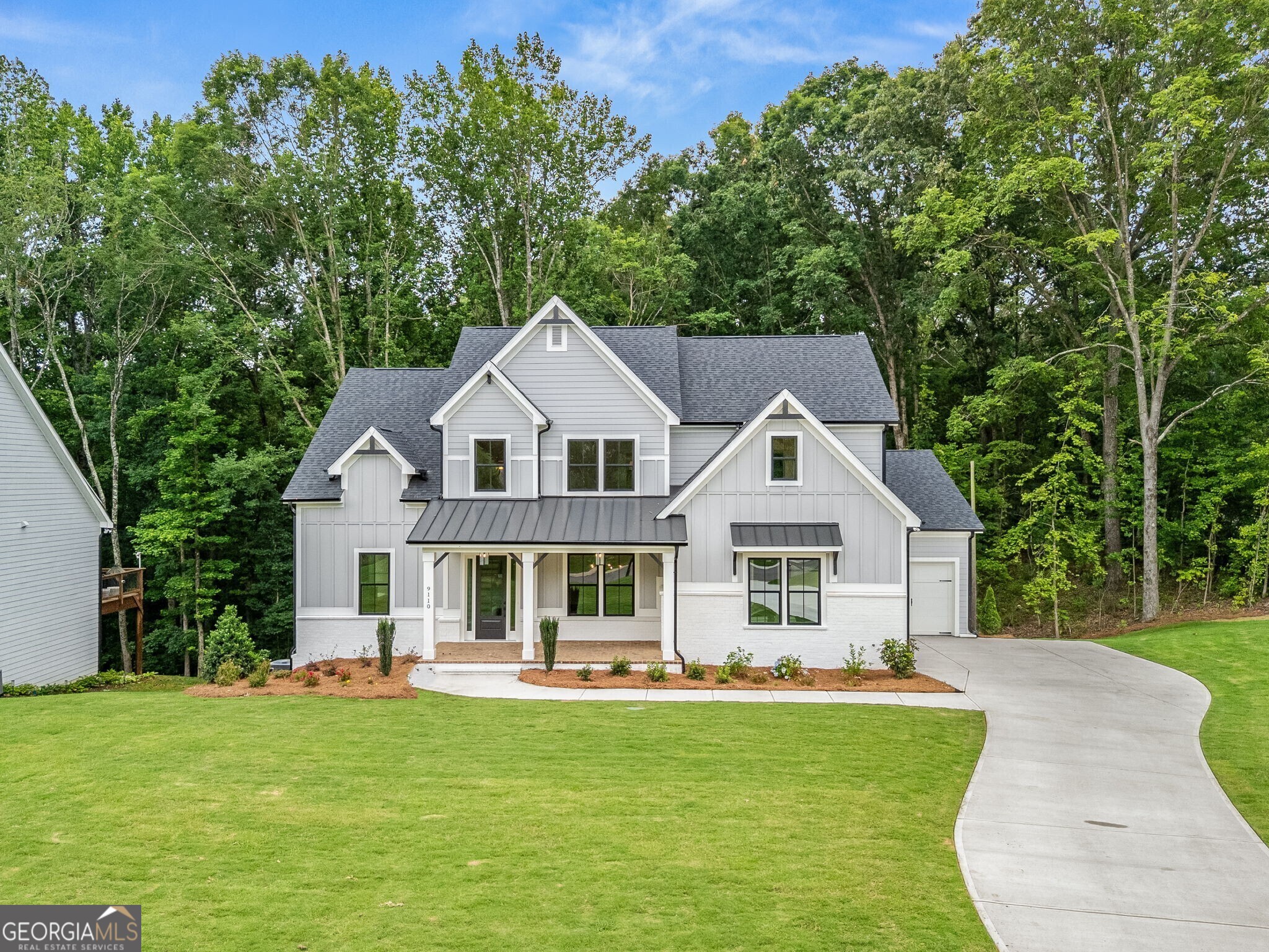 The Tiburon Plan built by Peachtree Residential Properties. Quick Move-In! This brand new home is weeks away from completion and offers a perfect blend of a beautiful home and a place to enjoy the lake. All the homes in this 15 homesite community come with a deeded, covered, deep water slip located at the community dock. The lake is just a quick golf cart ride away for you to enjoy your boating adventures. This home sits off the road and has an inviting rocking chair front porch. The 2 story foyer, flanked by the Dining Room leads to a Sunny Family Room with a fireplace with built-in cabinets on both sides and a wall of windows. The open concept living is perfect for entertaining with a kitchen with cabinets to the ceiling, large island, SS Kitchen Aid appliances, walk-in pantry and Breakfast Room with a door leading to the deck. The spacious laundry room has a sink with built-in cabinets, The Powder Room is located off the Mudroom. This home offers living flexibility with the Owner's Suite and a Guest Room on the main floor. The spa like Owner's bath has a shower, soaking tub and double vanities with quartz countertop as well as a walk-in closet. Upstairs there is a large Bonus Room and three bedrooms. Two of the bedrooms share a bathroom with separate vanities and walk-in closets. There is also a huge bedroom with a private bath and walk-in closet. There is also a large walk-in linen/storage closet upstairs. There are engineered hardwoods in the main living areas and up hall and carpet in the bedrooms and tile in the Laundry Room and Baths. The home has a 2-car side entry garage and a tandem garage. The large unfinished basement is perfect for expanding the living space. This community is a perfect place to call home and is minutes away lake fun, dining and shopping!
