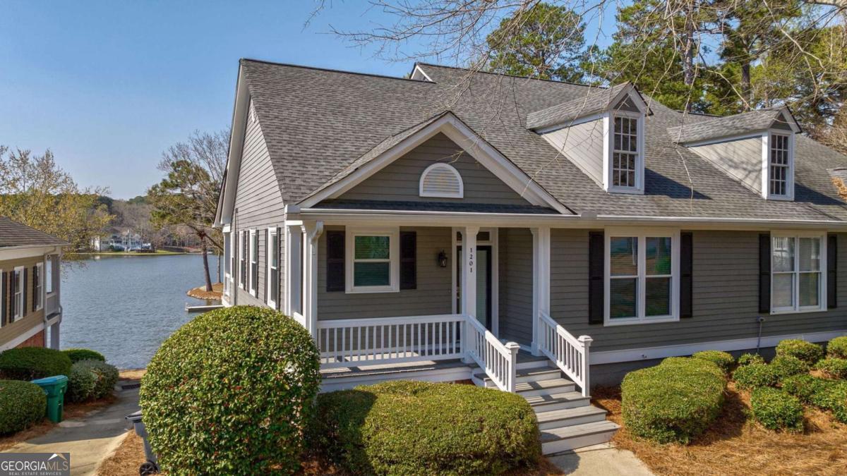 If you're looking for a great investment opportunity at Reynolds Lake Oconee, look no further. SOLD FURNISHED! This fully furnished, renovated townhome has day use docks and can be rented both short-term and beyond. 4-bedroom/3-bathroom with 2,680 feet of living space. From the moment you walk in the door the lake is front and center. Open floor plan that has been recently updated. Starting with the kitchen you have a restructured kitchen wall opening to the main living area. Kitchen cabinets recently painted, granite countertops, built-in microwave and a built-in pantry. Both the exterior and interior main have been recently painted. Main level porch screened with new under decking off the terrace level. New hot water heater. Master bathroom has been updated with shiplap accent and LED vanity mirrors. Washer and dryer on each level. Second kitchen on the terrace level with entertainment space perfect for guests or renters. Spacious bunk/media room on the terrace level as well. Seller is making a golf membership available. Don't miss this rare opportunity.