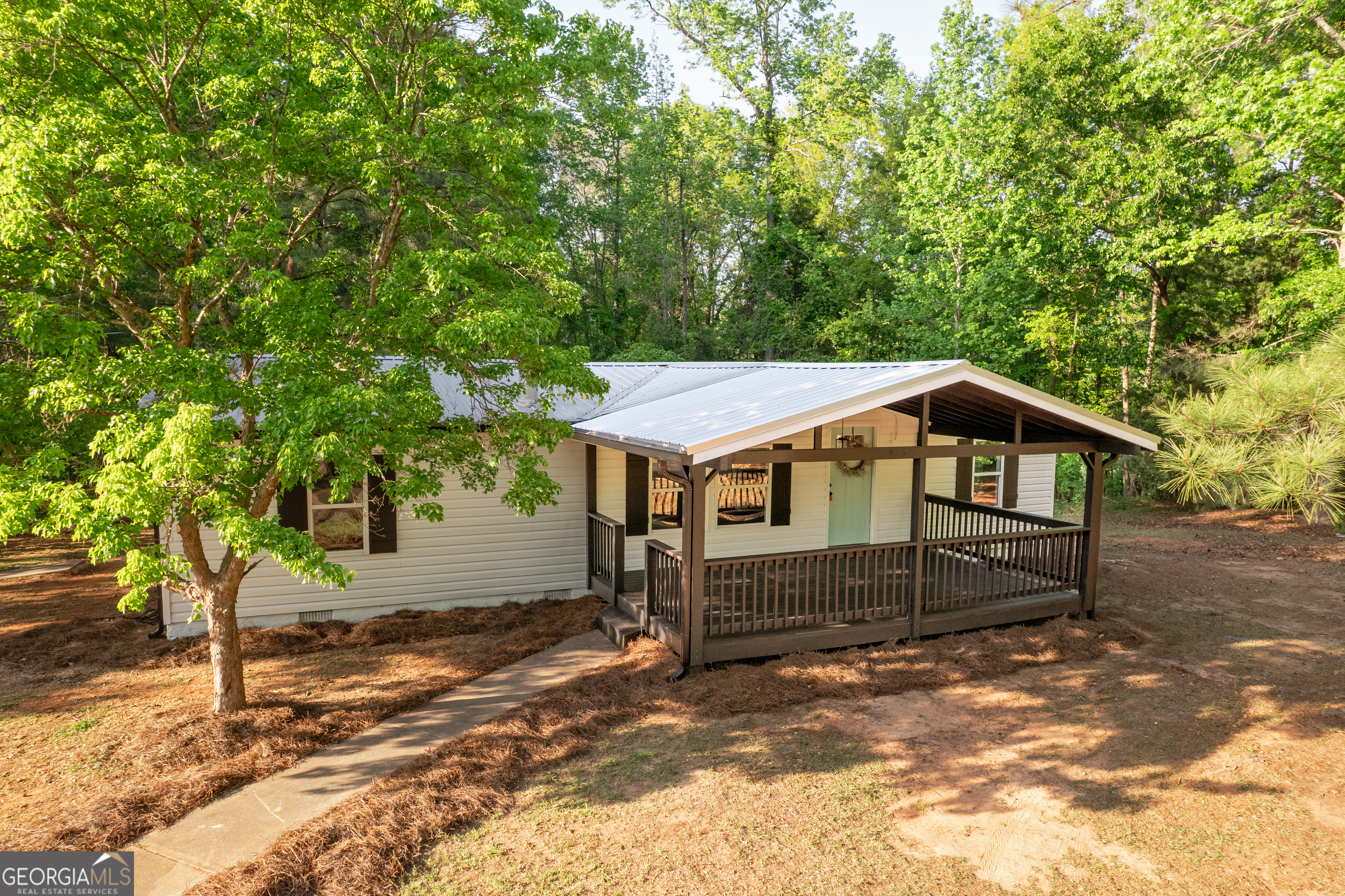 Turnkey 3-bed, 2-bath renovated country oasis on 1.02 acres-Featuring an open-plan living flows into a chef's island kitchen with stainless appliances. Large owners suite with a spa like bath with double vanity and soaking tub in owners suite. Two additional bedrooms and a secondary spa inspired bath. Expansive covered front deck and large back deck perfect for entertaining.