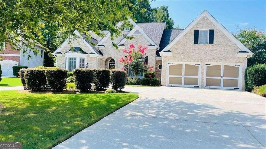 Welcome home! Beautifully spacious ranch home in pristine Lakefield Manor subdivision located in West Cobb! This beautiful 4 bedroom 3.5 bath brick front ranch home is situated on a level, corner cul-de-sac lot. The home has a spacious circular driveway along with a 6-car capacity driveway and 2 car garage. Foyer entrance boasts of high ceilings, with views to the separate dining room. Main level also features roommate floor plan with relaxing owner's suite on one side of the home including large ensuite bath, double vanities, separate garden tub and shower and large walk-in closet; while the other side of the home includes 2 additional bedrooms with Jack and Jill bathroom. Family room includes gas log fireplace, built in bookshelves and coffered ceilings and a wall of windows providing plenty of natural light. Rounding out the main floor is an eat-in kitchen with stainless steel appliances, granite countertops and pantry, an office/library (also with built in bookshelves) and the laundry room. Upper level includes the 4th bedroom and full bath perfect for a private guest or teen suite or extra storage space. Private, nicely landscaped backyard includes large patio perfect for relaxing and entertaining. The home is also equipped with a sprinkler system for the front and back yard. Neighborhood amenities include two swimming pools, tennis courts, central park, two lakes (stocked with fish) and walking trails. The community is close to shopping and is less than 3 miles from Kennesaw Mountain trails and hiking. Marietta Square and Battery Atlanta are also nearby. Schedule your appointment today to see all this home has to offer!