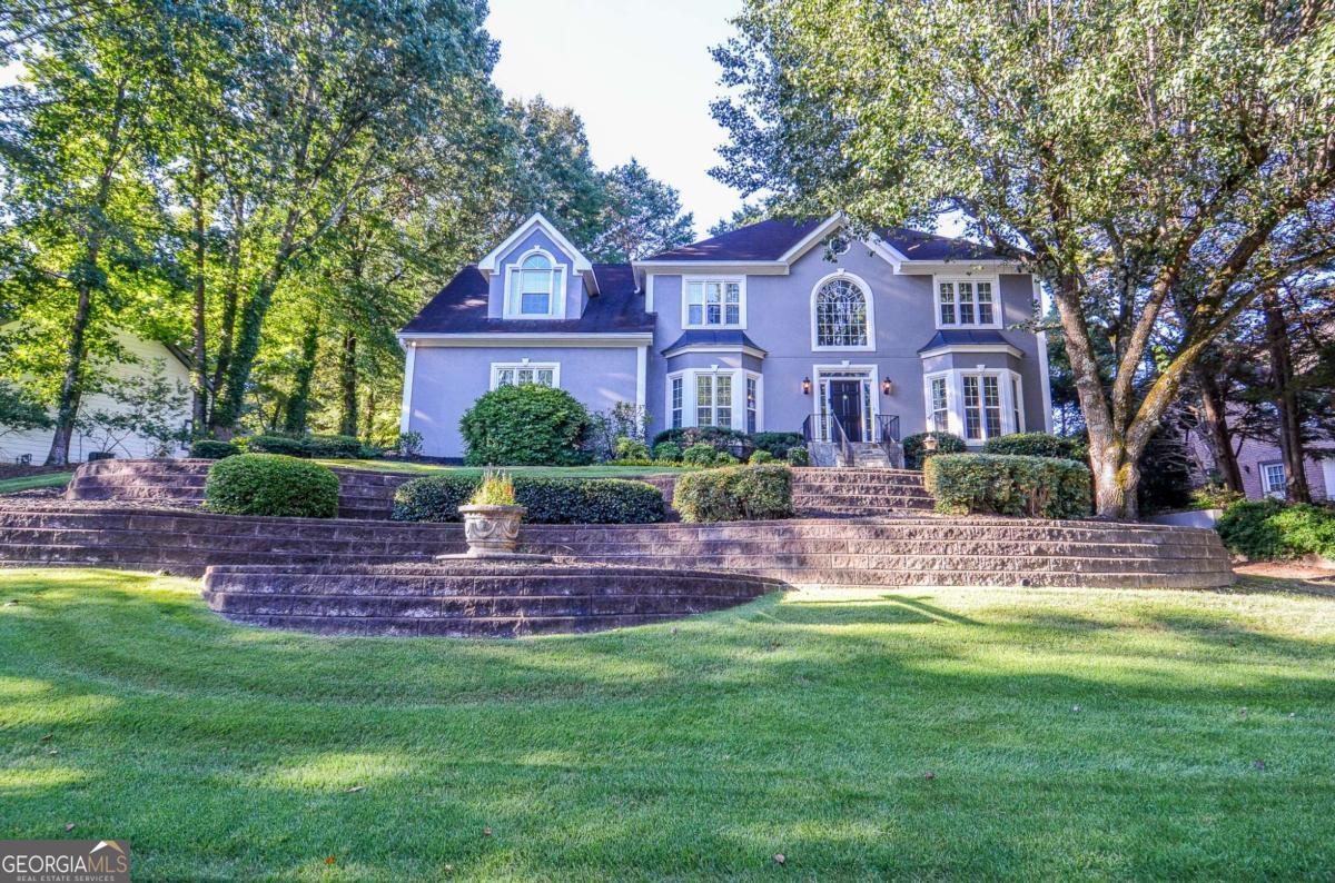 Welcome to your updated dream home in the highly sought-after Johns Creek High School district! This stunning 4-bedroom, 3.5-bathroom residence has been meticulously updated from top to bottom, offering a seamless blend of modern luxury and move-in readiness. This isn't just a house; it's your sanctuary, a fresh canvas ready to be filled with your laughter and memories. Step inside to find a bright and airy interior adorned with fresh, neutral paint, creating a perfect canvas for your style. The heart of the home is designed for both everyday living and entertaining, flowing effortlessly to the incredible outdoor oasis. We give you the peace of mind that comes with brand-new plumbing, new windows, and new siding-a promise of cozy, worry-free winters and cool, serene summers. But the true magic happens out back. Your expansive two-level deck beckons for Saturday morning pancakes with the family, sunset conversations with good friends, and quiet moments under the stars. It's not just a deck; it's the stage for your future gatherings, celebrations, and the simple, precious everyday moments. Downstairs, the basement boasts new carpet and is perfect for movie nights that turn into memories or a playroom where imaginations run wild. Additional storage space? We've got that covered with TWO finished storage rooms!! Here, you're not just buying a house. You're investing in a lifestyle. Nestled in the award-winning Johns Creek High School district, mere minutes from top-rated dining, upscale shopping, and abundant outdoor activities at Jones Bridge Park and the Chattahoochee River. This is more than a list of updates. It's the foundation for your next chapter. This home truly has it all: superior schools, a premier location, and no deferred maintenance. Come and see it before it's gone!