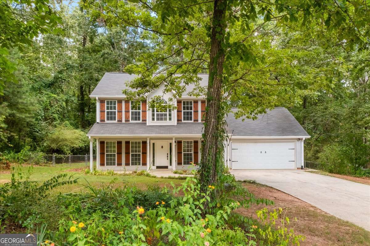 Welcome Home to 2335 Mathew Ct, Monroe, GA! Nestled on a full acre with no HOA, this beautifully maintained 3 bedroom, 2.5 bath home offers the perfect blend of comfort, privacy, and style. The main level features durable tile flooring, while the upper level showcases newly installed flooring and fresh paint throughout, adding warmth and easy maintenance. The spacious primary suite includes an en suite bath with a separate shower and a generous walk-in closet, offering a peaceful retreat after a long day. Enjoy the seamless indoor outdoor living with a screened in covered patio that opens up to a fully fenced backyard, ideal for pets, play, or peaceful evenings under the stars. Your One Acre Oasis Awaits ! Privacy, Comfort, and No HOA!