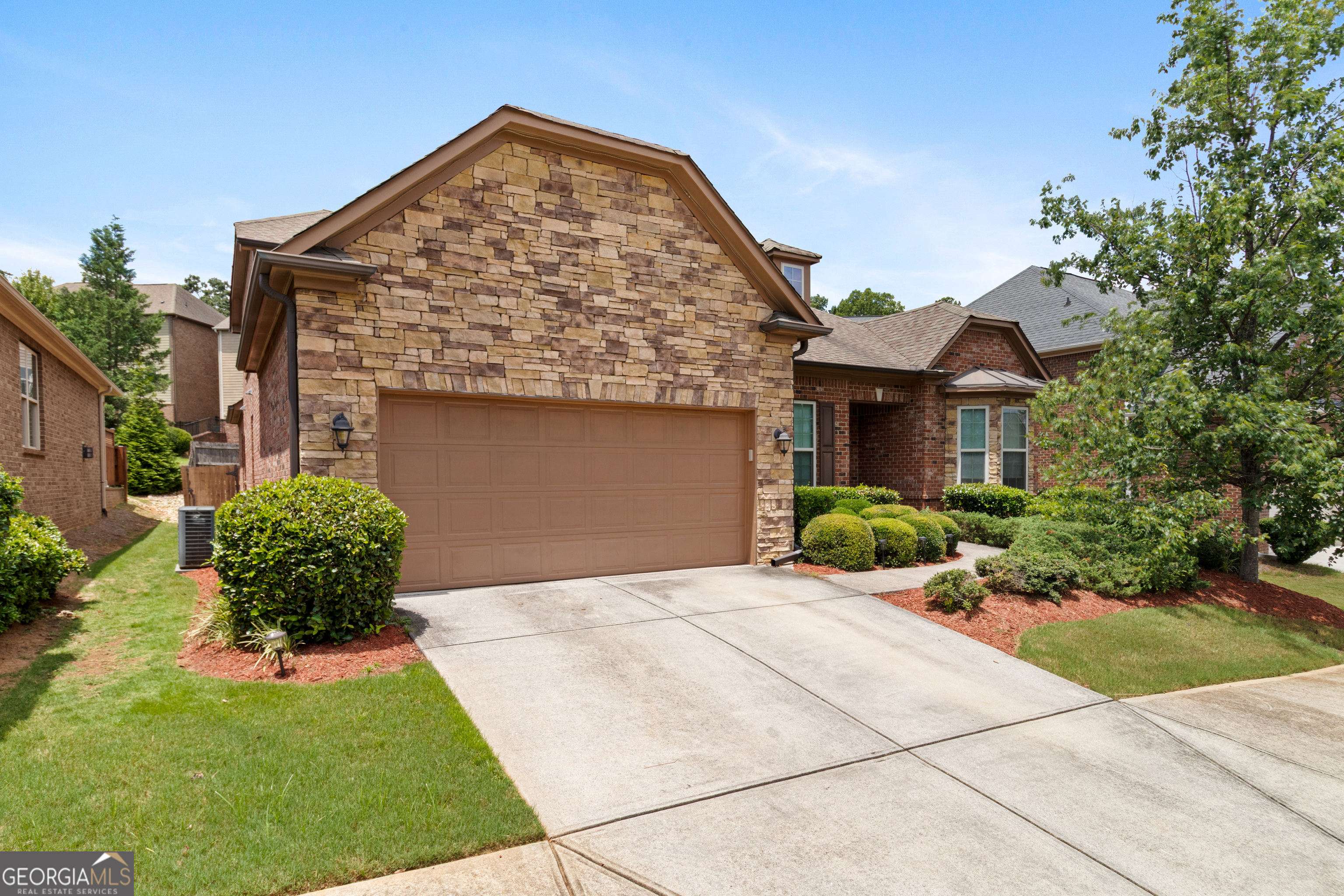 Welcome to 3692 Terrah Point Drive, a beautifully maintained 4-bedroom, 3.5-bath ranch-style home nestled in the sought-after Lakes at Sugarloaf community. Boasting over 3,000 square feet of thoughtfully designed living space, this home offers the perfect blend of comfort and functionality. From the moment you step inside, you're greeted by fresh interior paint and elegant wood-look laminate flooring that flow throughout the main level, creating a bright and inviting atmosphere. The spacious layout includes a dedicated home office that can also serve as a guest room, as well as a large upstairs loft with its own full bath and linen closet-ideal for use as a media room, playroom, or secondary living space. The heart of the home features an open-concept kitchen with modern appliances and ample cabinetry, flowing seamlessly into the cozy family room highlighted by a charming masonry fireplace. The primary suite provides a peaceful retreat with a private en-suite bath, while two additional bedrooms and a conveniently located half bath complete the main floor living area. Outside, the home showcases a tasteful stone, brick, and vinyl exterior, along with a welcoming front porch and a fenced backyard with an enclosed patio perfect for outdoor entertaining or quiet evenings. This property also includes an attached two-car garage. Located in the highly regarded Gwinnett County School District. With a low monthly HOA and proximity to shopping, dining, and commuter routes, this home offers both convenience and quality of life. Don't miss the opportunity to make this versatile and move-in-ready home yours.