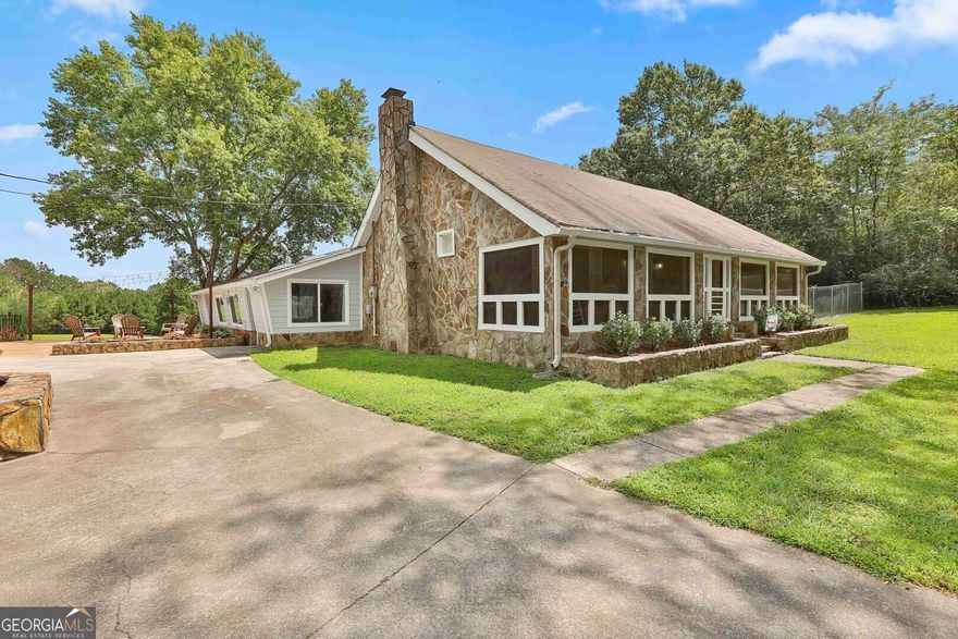 Welcome home to your own slice of paradise! This charming 4 bedroom, 2 bath home sitting on 8.06+/- acres comes with a host of desirable features that make it truly exceptional. Step into the spacious living room, perfect for quiet relaxation or lively gatherings. The abundance of space allows for versatile furniture arrangements, making it easy to create your ideal entertainment area. In the heart of the home, a big country kitchen awaits! This inviting space is the spot for culinary enthusiasts and those who enjoy hosting family and friends. With ample counter space and room to move around, meal preparation becomes a joyous experience. Adjacent to the kitchen, a convenient laundry room adds practicality and convenience to your daily routine. Everything is within arm's reach, making household chores a breeze! Step down the hallway to enjoy the privacy of the bedrooms. The master bedroom creates a serene atmosphere where you can escape the stresses of the day by the cozy fireplace. Newly renovated master bath with new vanity, paint, shower, and soaking tub! And the delights don't stop there - step outside to discover your very own backyard oasis. The inground pool offers a refreshing retreat during the warmer months, while the hot tub provides a cozy spot to unwind and stargaze on cool evenings. The sprawling pasture offers a picturesque view and the perfect opportunity for outdoor activities. Imagine the possibilities with the 24'x40' workshop with your very own office space complete with a bathroom, sink, and built-in shelves, 40'x32' four car detached garage with separate storage area, and 48'x30' pole barn! From tending to your pasture to crafting in your workshop, to enjoying the pool and hot tub year-round, there are limitless opportunities. This home combines comfort, recreation, and functionality in a way that's rarely found. Don't miss the opportunity to make this paradise your own! Call The Charles Davis Team today to get more information and schedule a showing!