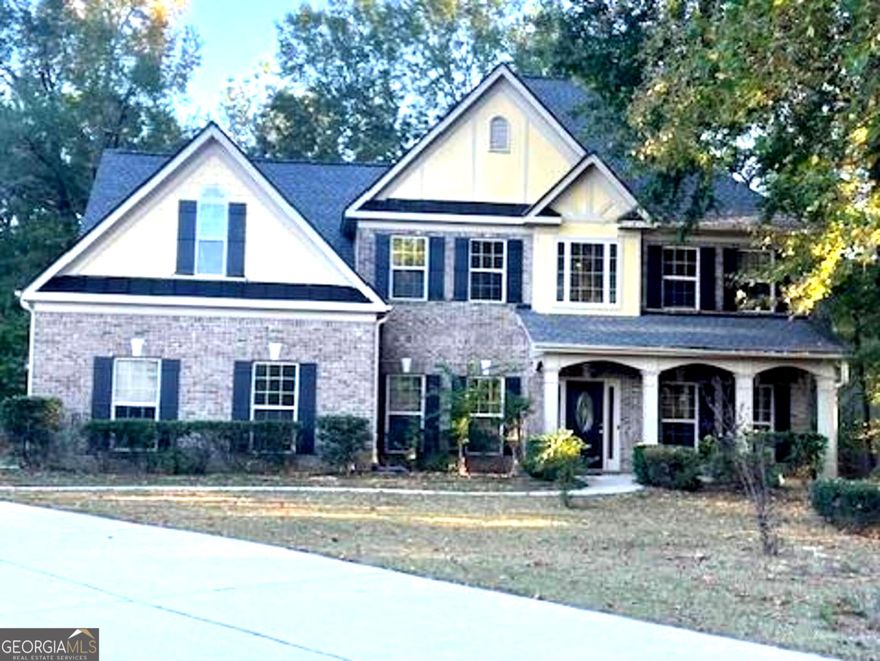 Gorgeous 5 Bedroom Craftsman in a Peaceful Cul-De-Sac.       Welcome home to this stunning 3 sided brick, 5 bedroom, 3 bath, 3 car garage craftsman style beauty, nestled on a generous lot perfect for gardening and outdoor living! Enjoy the abundant land, ideal for planting, growing, or simply relaxing on your own private oasis.          Step inside and fall in love with the tray and vaulted ceilings found throughout the bedrooms, including the formal living room with tray ceiling. The first floor showcases separate dining and family room, crown molding, ornate columns, judges paneling and 1st floor guest bedroom.   Enjoy gleaming granite countertops, porcelain backsplash, and solid wood cabinetry that brings both warmth and durability to the kitchen. The chef's kitchen receives lots of natural and recessed lighting and features a gas cooktop, wall oven, microwave, and even includes a refrigerator (located in the garage) for your convenience.   Each bedroom feels like a retreat with its own architectural charm, and the spacious layout provides comfort, style, and room to grow. The owner's suite is an amazing oversized bedroom, sitting room and in-suite spa like bathroom. Just beyond the double, french doors are his and hers sinks on opposite walls, jetted tub, walk-in ceramic shower and linen closet.  Additional 3 upstairs bedrooms feature beautiful tray and vaulted ceilings and ample closet space.     Located in a small neighborhood on a quiet Cul-De-Sac, its the perfect blend of elegance, comfort, and space. Don't miss this opportunity; homes like this don't come around often!