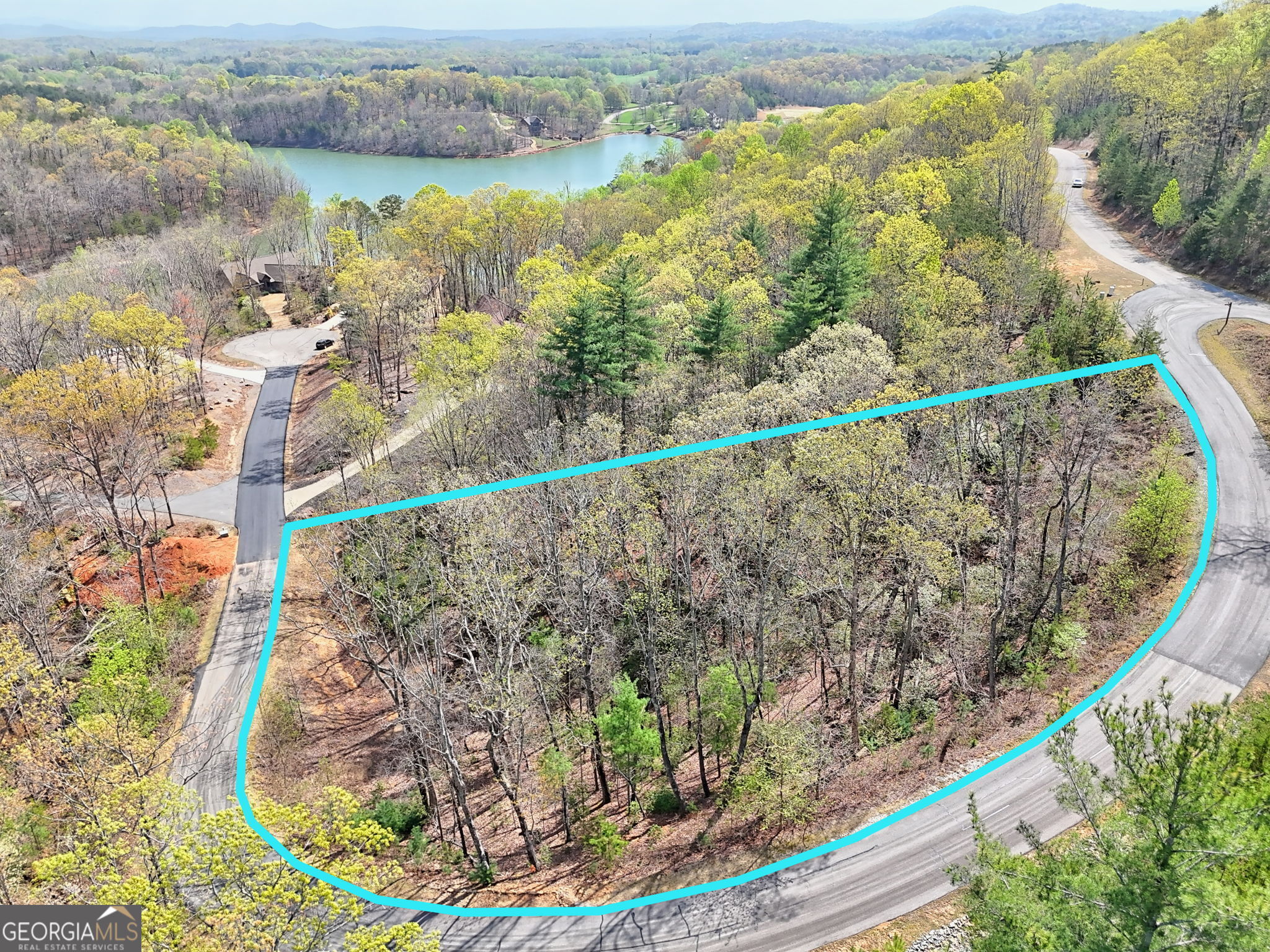 Hidden just off the square in Cleveland exists the beautiful private, gated community Lake Laceola. You can enjoy the mountain views, sunsets and sunrises that surround you in your new home . Lot 239 is a 1.71 acre mountain view lot with many possibilities. Located just 1-1/2 hours north of Atlanta, makes for an easy drive to your place of serenity and peace. A short 5 minute drive to downtown Cleveland, Helen and close to numerous hiking trails, wineries, and State Parks. The lot has a gradual slope. . Amenities include a clubhouse with a kitchen, bar, great room, outdoor grill and covered/uncovered firepits and a community pool.