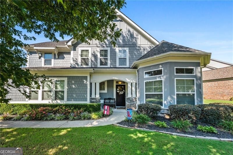 Welcome to your dream home in the highly sought-after Carmichael Farms swim/tennis community! This stunning 5-bedroom, 3.5-bath Craftsman-style beauty blends timeless elegance with modern convenience. Step inside to discover a spacious and flexible layout featuring a generous main-level suite-perfect as a primary bedroom or guest retreat. Upstairs, the expansive owner's suite offers a luxurious spa-inspired bath and an oversized walk-in closet you'll love. Work from home in style in the custom-built study, complete with a secure, built-in safe ideal for collectors or added peace of mind. The heart of the home is the gourmet kitchen, boasting a custom island, granite countertops, stainless steel appliances-including a wall oven, gas range with stainless hood-and a bright, sunlit dining nook. Step outside to your private oasis: a large, level fenced backyard with a paved patio and cozy fire pit-perfect for entertaining or relaxing under the stars. All this, plus top-notch community amenities and an unbeatable location. Don't miss your chance to call Carmichael Farms home!
