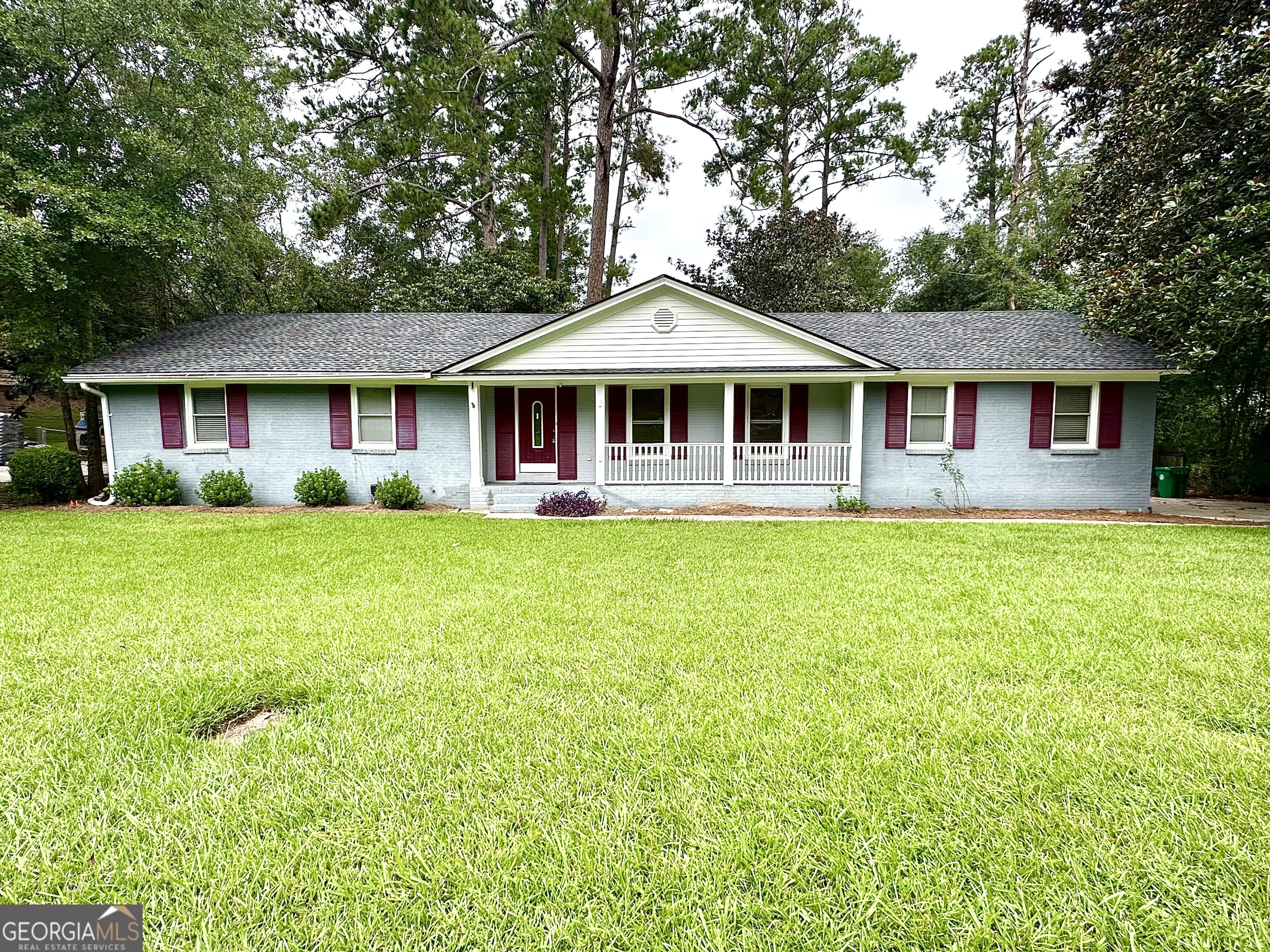Beautiful 4BR/3BA home located in Old Wood Valley. Step inside where you will find hardwood oak floors and tile throughout. Large kitchen with brick archway over the range and a counter height bar top opening to the living room with fireplace. Three bedrooms on the main level with one bedroom down the stairs on the basement. Master suite offers a double vanity, separate tub, and walk-in closet. Look out from the wood deck at your large fenced-in backyard and separate storage shed. Brand new roof installed in 2024! This house is conveniently located to VSU, SGMC, Shopping, & Moody AFB. Call today before it's too late!