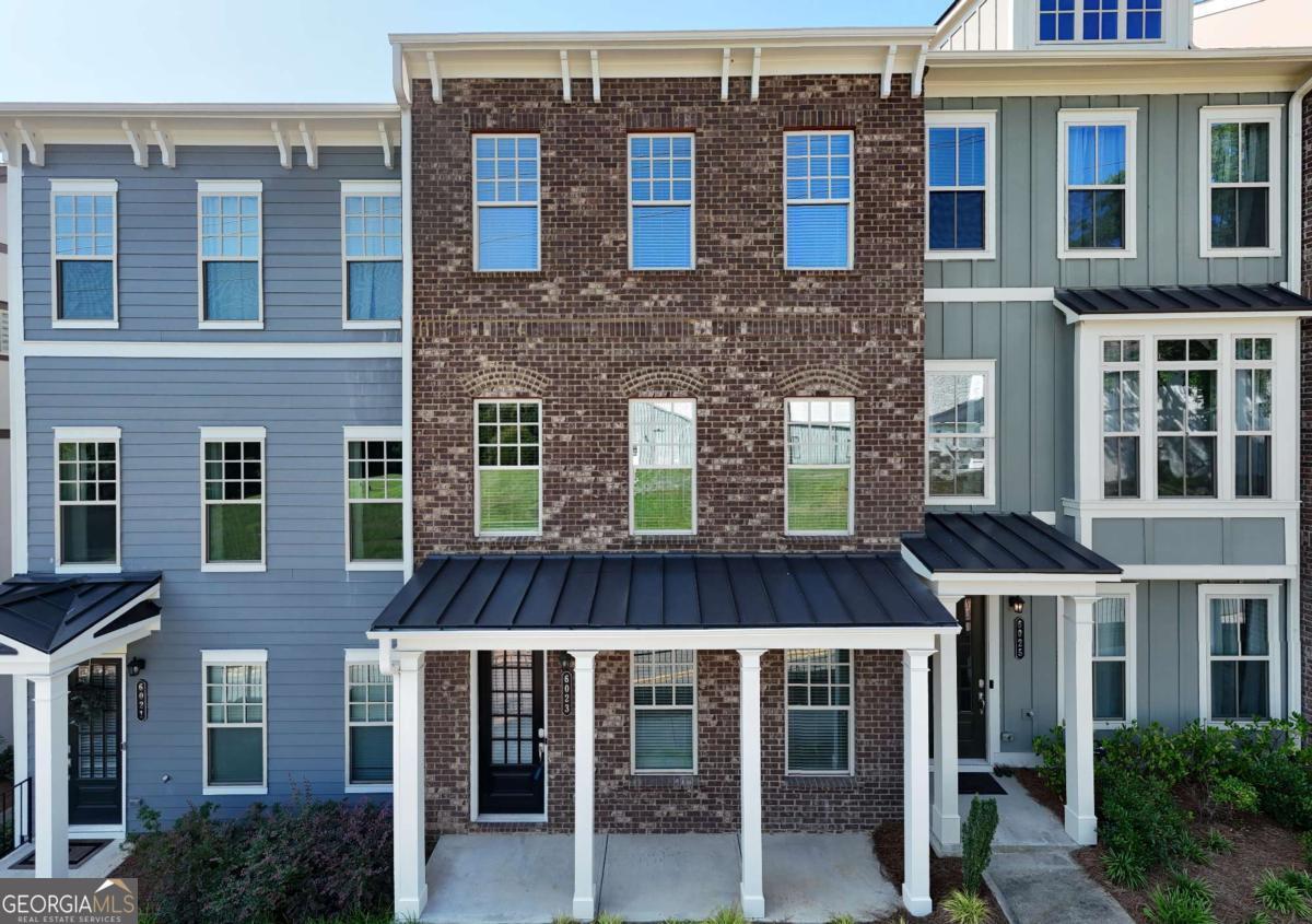 Welcome to your new luxurious townhouse in Norcross! This stunning brand-new property is just a short walk from the charming Historic Downtown area and offers easy access to I-85 via nearby Jimmy Carter Blvd. This spacious townhouse boasts 4 bedrooms, 3 and a half bathrooms, and a 2-car garage, providing ample space for you and your family. The terrace level includes a bedroom and a full bathroom, perfect for hosting guests or providing additional privacy. The second level is ideal for entertaining, with a cozy family room featuring a fireplace and an open kitchen with granite countertops and stainless steel appliances. Adjacent to the dining room is a delightful deck, perfect for enjoying a cup of coffee or soaking up the sun. On the third floor, you'll find three beautiful rooms, including a spacious master bedroom and bathroom with a walk-in shower and a comfortable seat. Across from the master bedroom, you'll find two additional bedrooms and a convenient laundry room nestled between the rooms. Don't miss out on the opportunity to make this exquisite townhouse your new home. Contact us today to schedule a viewing!