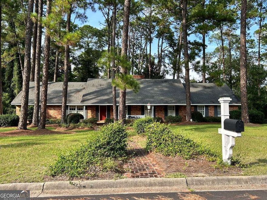 Make this charming home your home today! This four-bedroom 3bath home has lots of charm & character.  This home offers formal living room & dining room with front foyer access. Back den has pine walls, gas logs in fireplace, & large window overlooking back yard.  The kitchen has updated appliances, granite, tiled backsplash, and is open to breakfast area.  Three bedrooms & two baths are located on the main floor.  Both bathrooms have been remodeled.  Large master suite with two closets & tiled shower.  Beautiful hardwood floors throughout the home refinished in 2017.  Upstairs has a large bedroom & 1 full bath with dressing area.  Laundry room located off of the kitchen with folding table & extra storage space.  Double lot, deck off den, large front porch, carport with two storage rooms, private back yard & more.